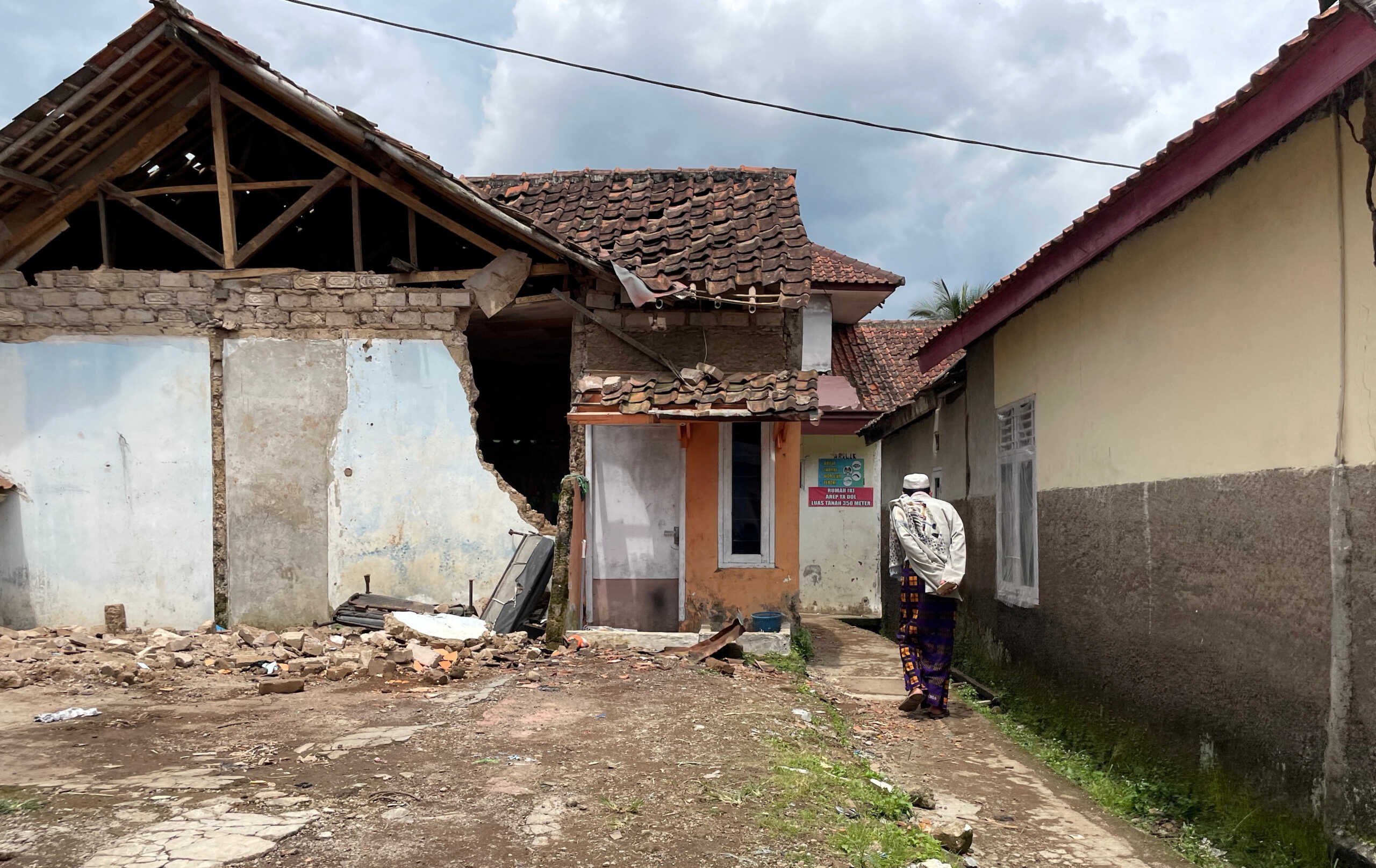 A Muslim man makes his way after attending Friday prayers, following Monday's earthquake in Cianjur, West Java province, Indonesia, November 25, 2022. REUTERS