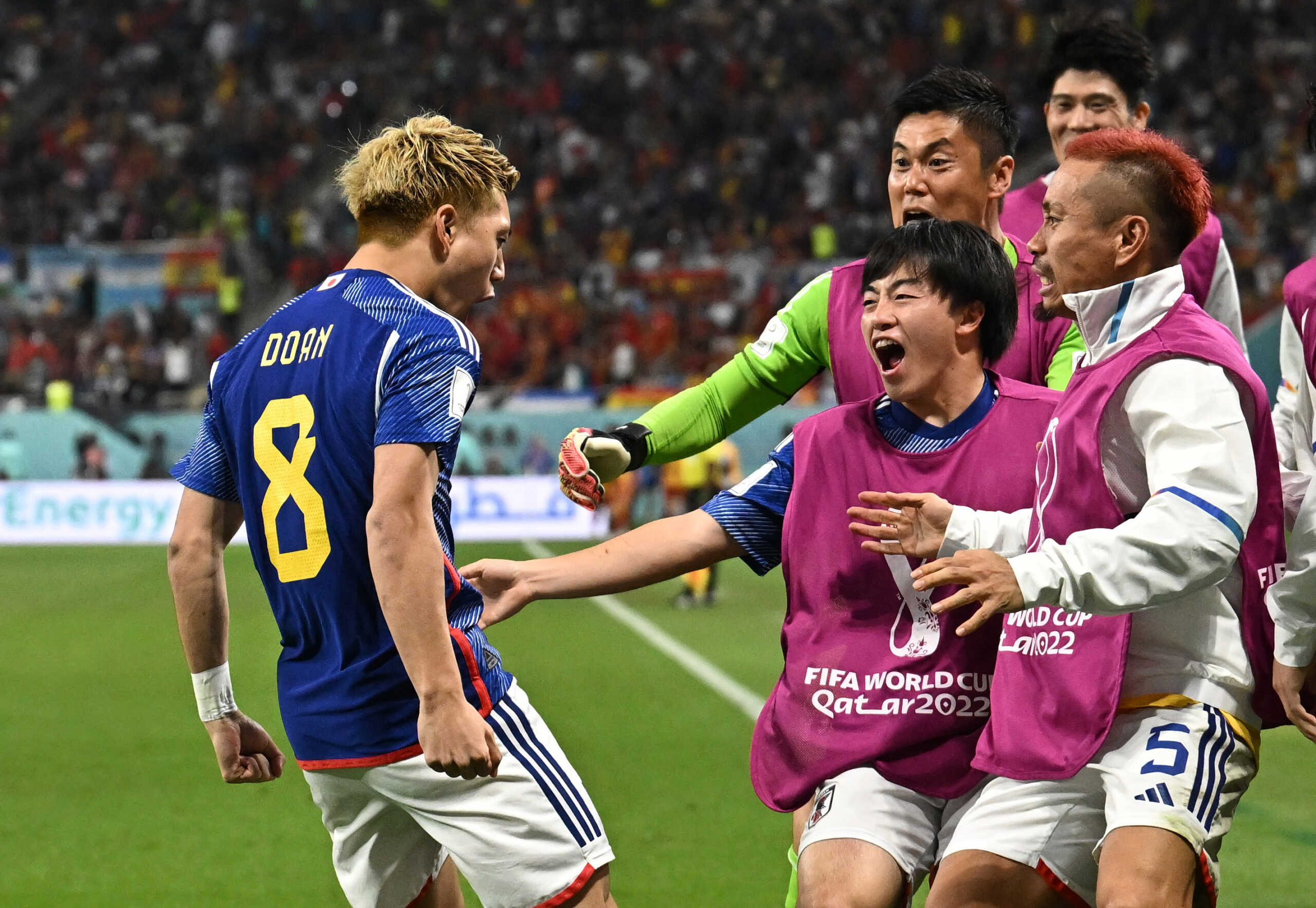 Soccer Football - FIFA World Cup Qatar 2022 - Group E - Japan v Spain - Khalifa International Stadium, Doha, Qatar - December 1, 2022  Japan's Ritsu Doan celebrates scoring their first goal with teammates REUTERS