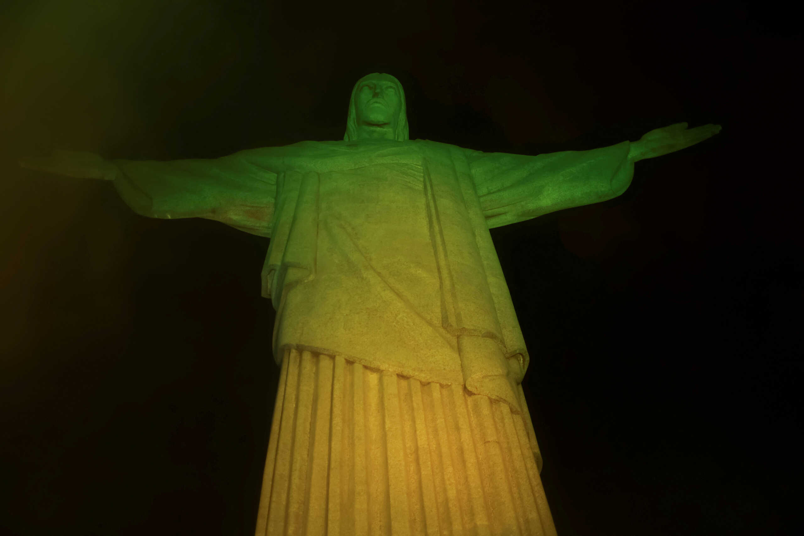 Christ the Redeemer statue is lit up in Brazilian colours as a tribute to late Pele, in Rio De Janeiro, Brazil, December 29, 2022. REUTERS