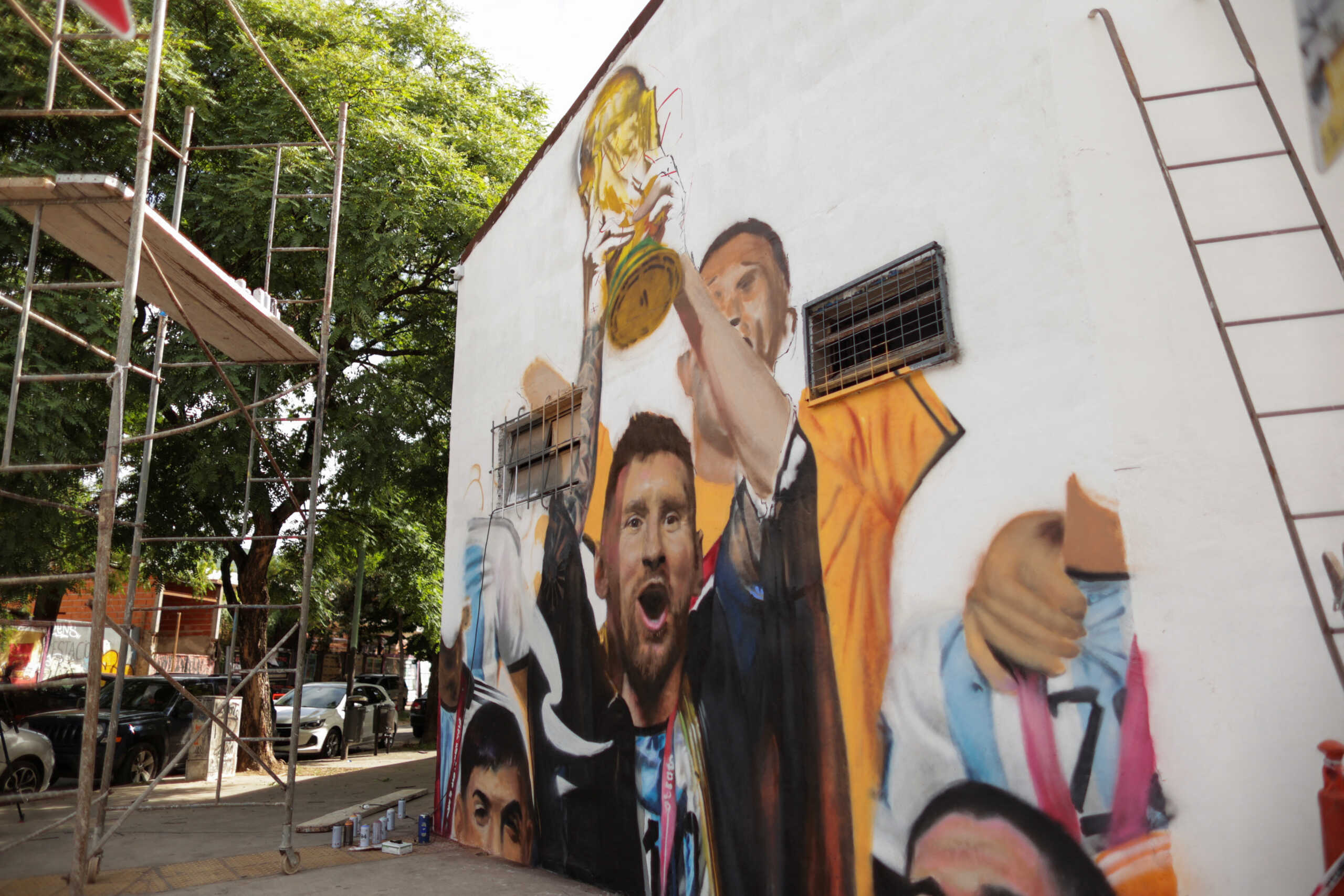 A view shows a mural depicting Argentinian soccer star Lionel Messi lifting the FIFA World Cup Qatar 2022 trophy by muralist Maximiliano Bagnasco, in Buenos Aires, Argentina December 21, 2022. REUTERS