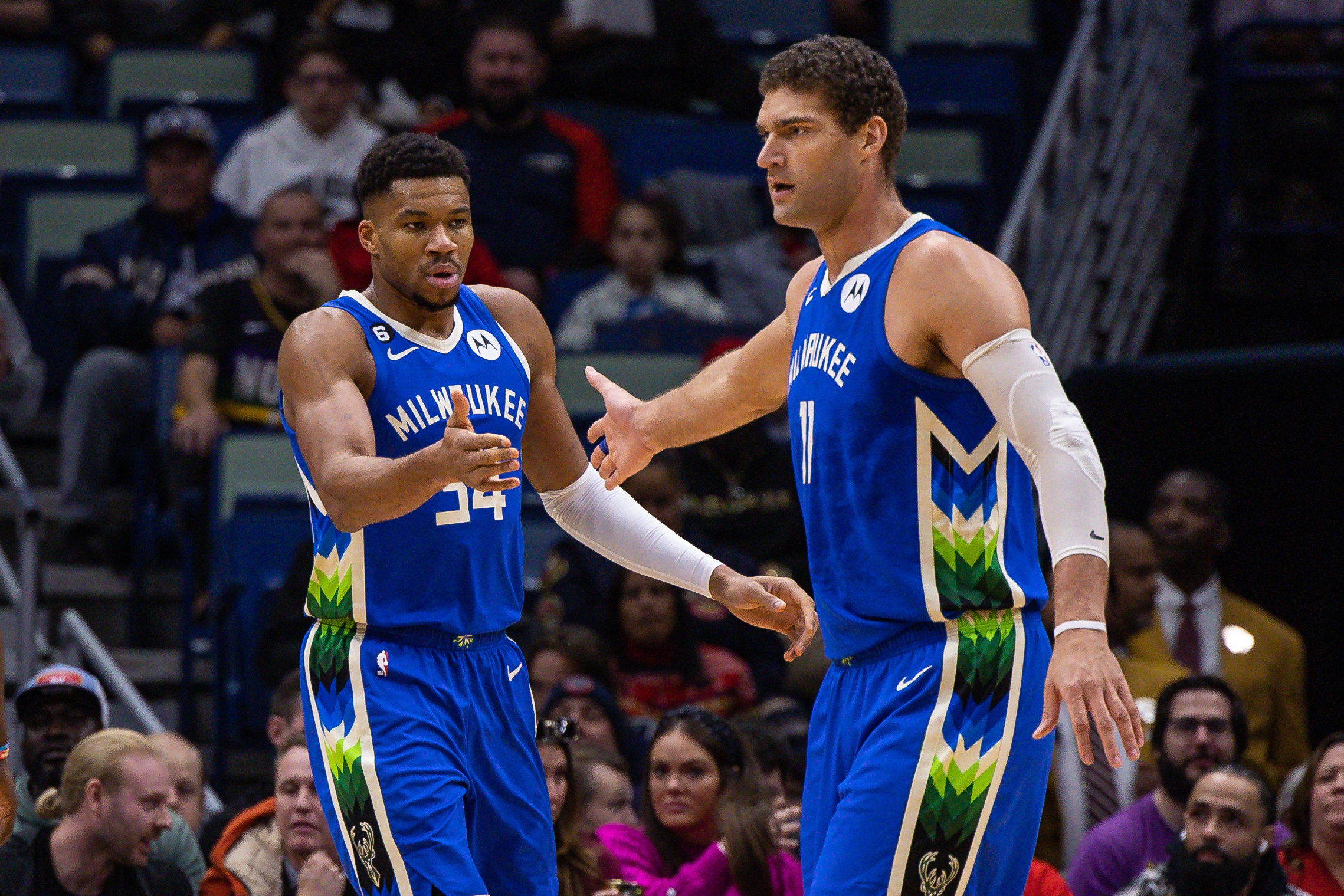 Dec 19, 2022; New Orleans, Louisiana, USA; Milwaukee Bucks forward Giannis Antetokounmpo (34) is congratulated by center Brook Lopez (11) after a play against the New Orleans Pelicans during the first half at Smoothie King Center. Mandatory Credit: Stephen Lew-USA TODAY Sports