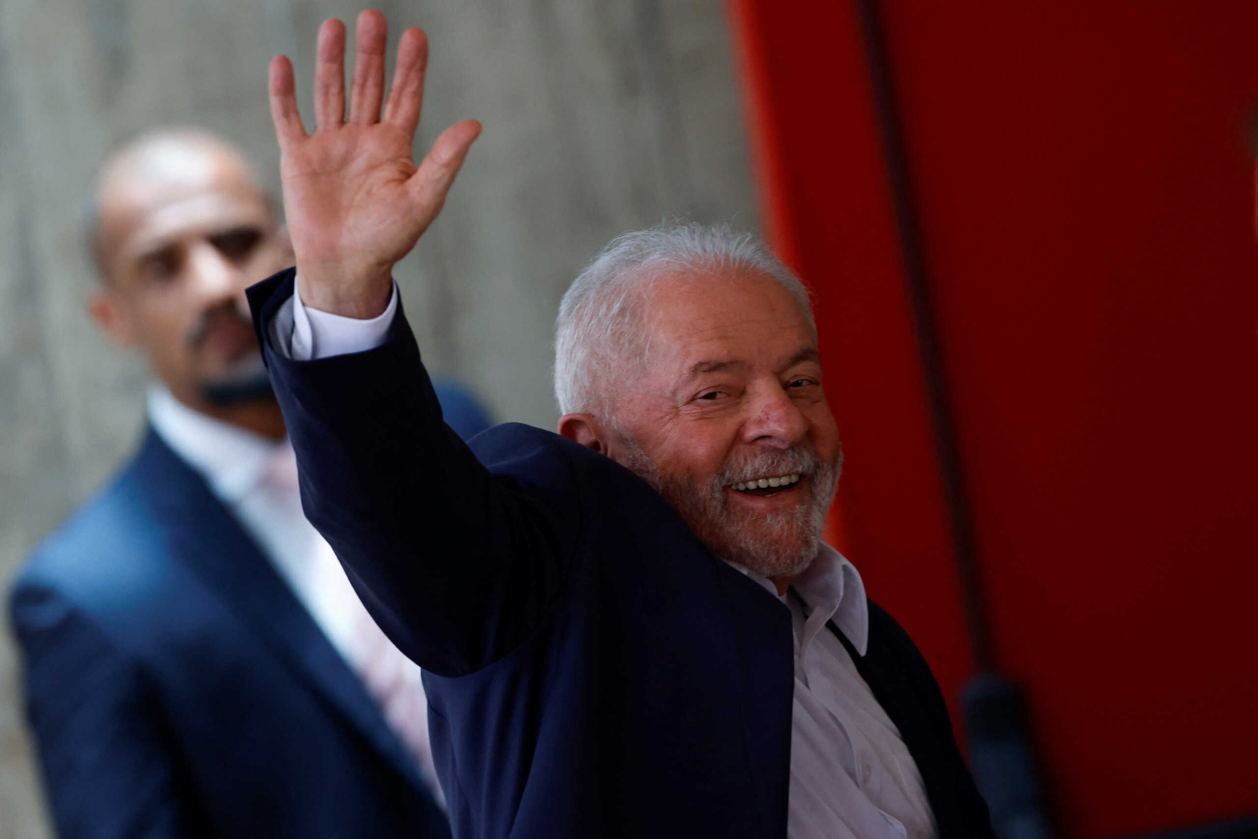 Brazilian President-elect Luiz Inacio Lula da Silva waves before attending a meeting at the transition government building in Brasilia, Brazil November 28, 2022. REUTERS