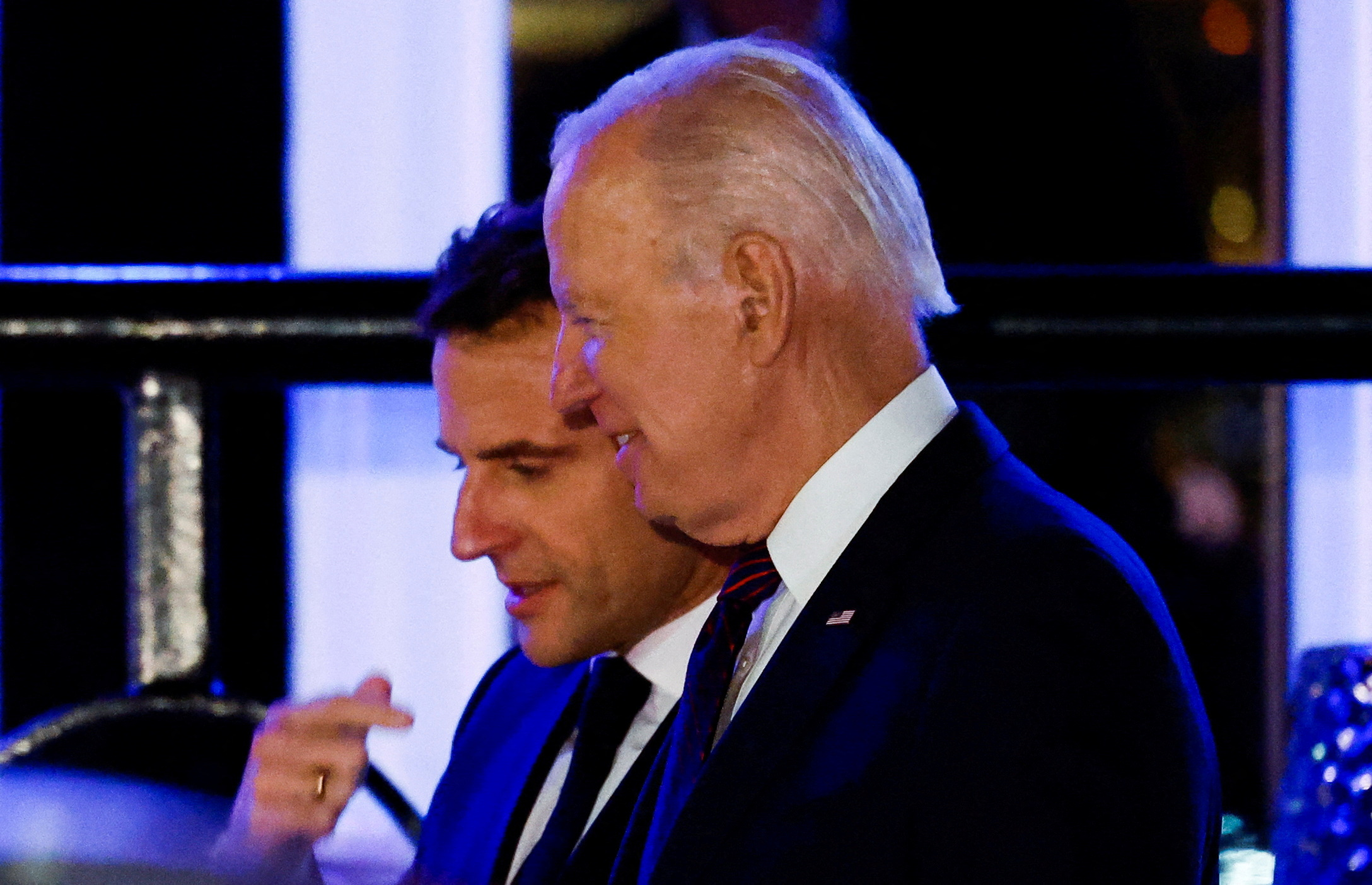 U.S. President Joe Biden and French President Emmanuel Macron talk outside Fiola Mare restaurant in the Georgetown neighborhood of Washington, U.S., November 30, 2022.  REUTERS