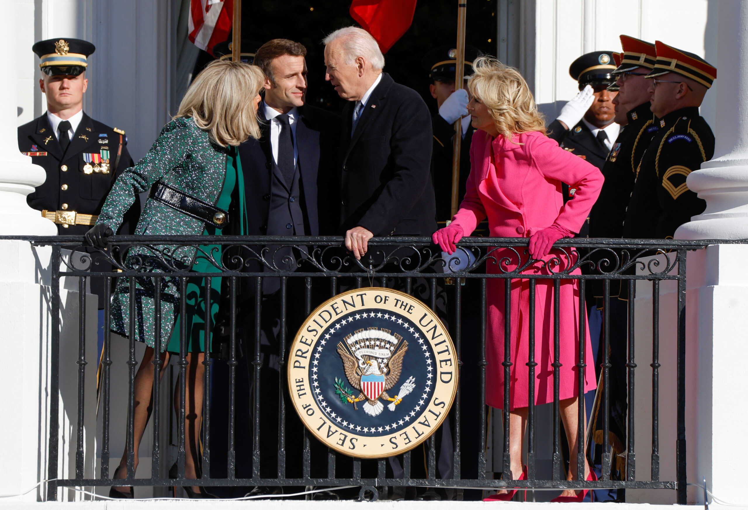 French President Emmanuel Macron and U.S. President Joe Biden and their wives French first lady Brigitte Macron and U.S. first lady Jill Biden talk as they pose on the Truman Balcony after an official State Arrival Ceremony for Macron on the South Lawn of the White House in Washington, U.S., December 1, 2022. REUTERS