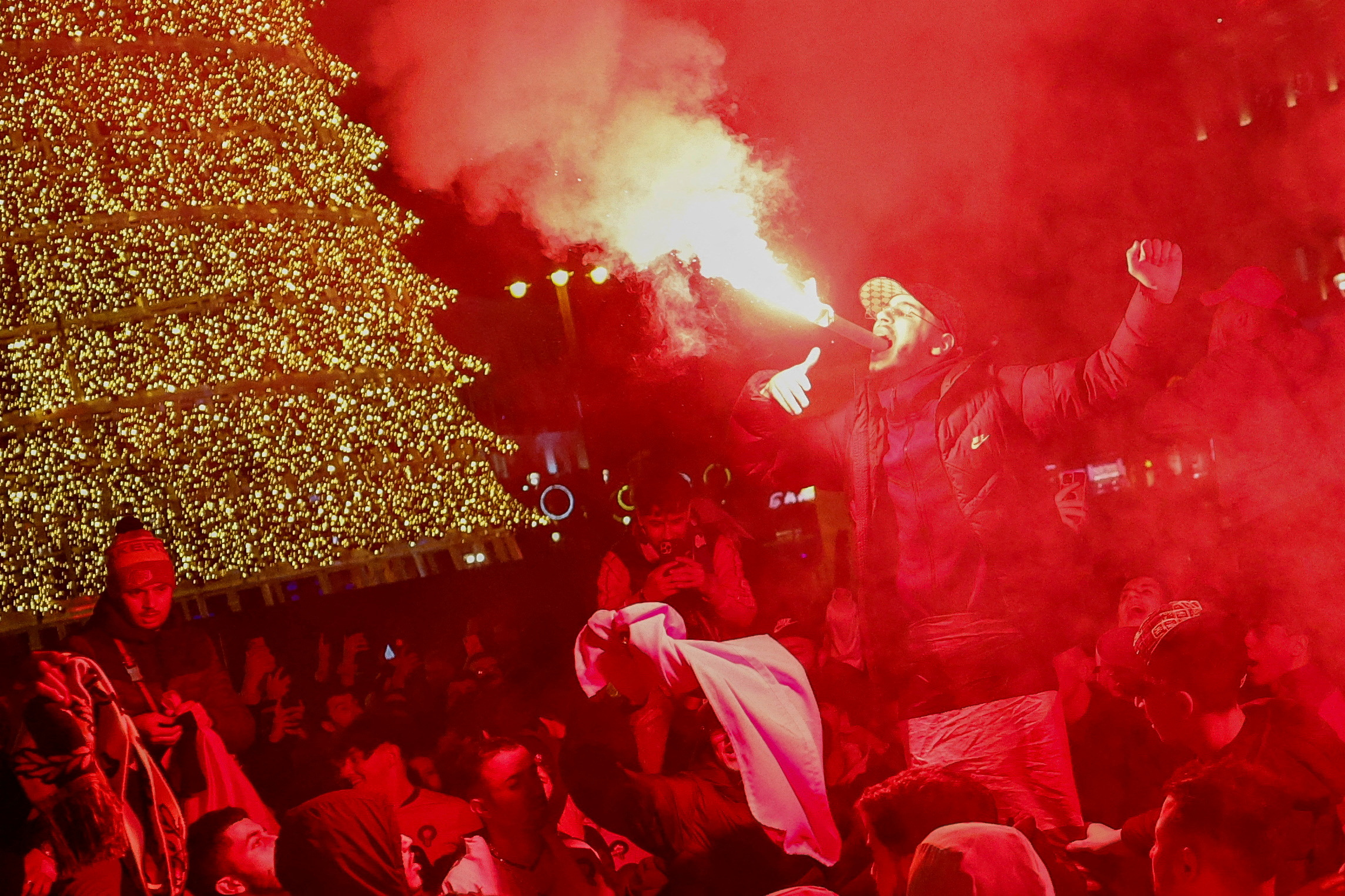 Morocco fans celebrate as they gather in Sol square after the FIFA World Cup Qatar 2022 match between Spain and Morocco, in Madrid, Spain December 6, 2022. REUTERS