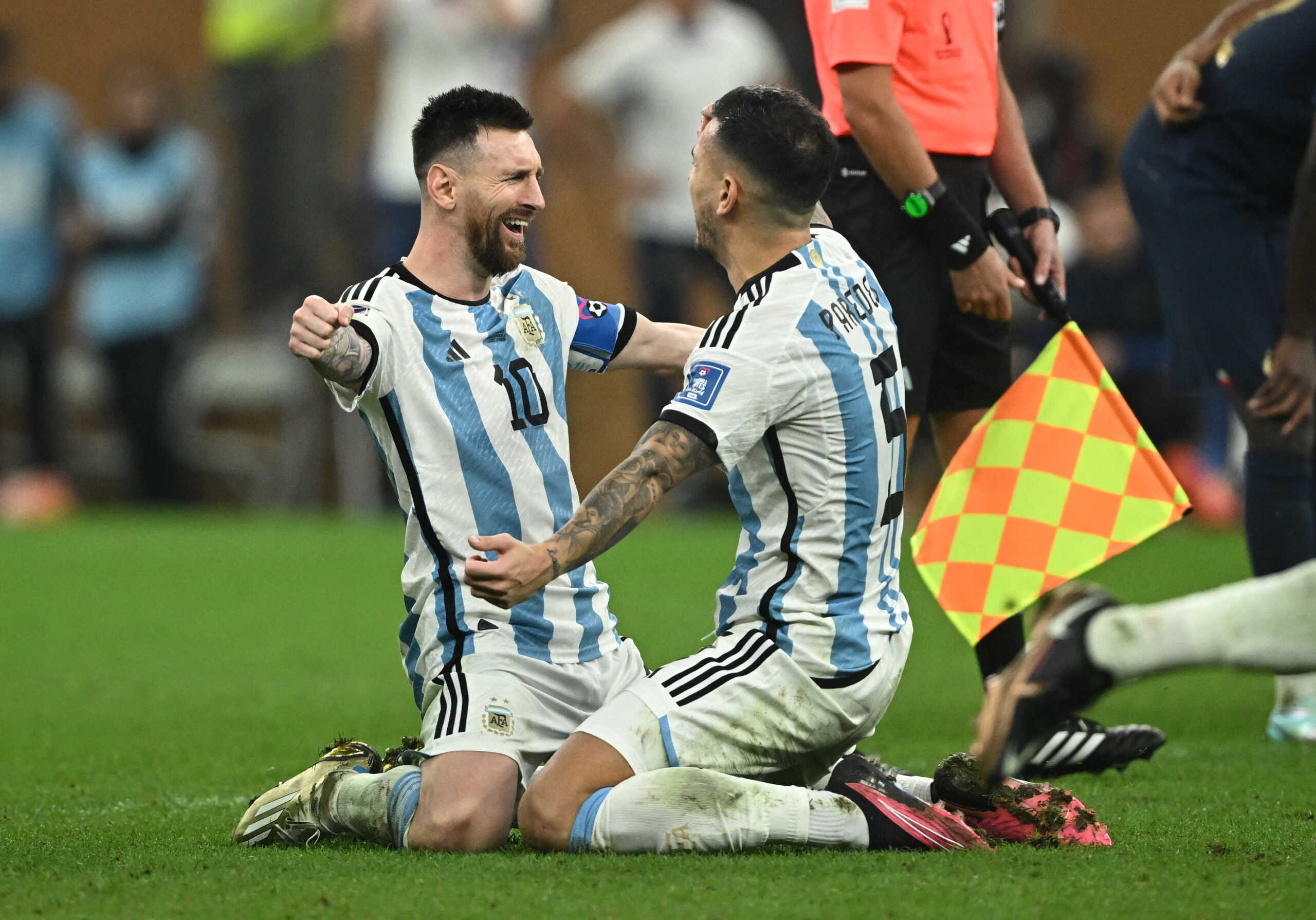 Soccer Football - FIFA World Cup Qatar 2022 - Final - Argentina v France - Lusail Stadium, Lusail, Qatar - December 18, 2022  Argentina's Lionel Messi celebrates with Leandro Paredes after winning the World Cup REUTERS