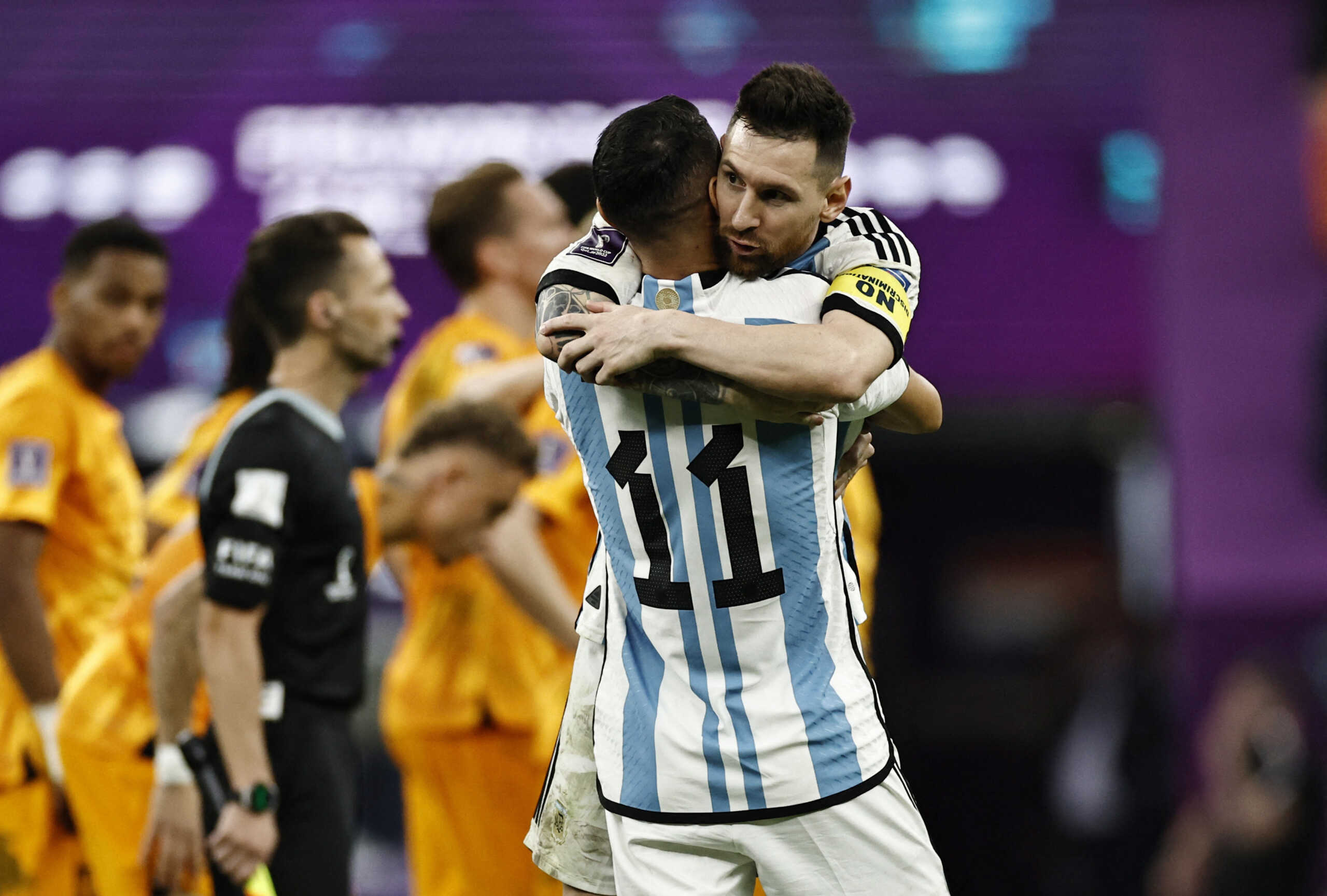 Soccer Football - FIFA World Cup Qatar 2022 - Quarter Final - Netherlands v Argentina - Lusail Stadium, Lusail, Qatar - December 10, 2022 Argentina's Lionel Messi and Angel Di Maria celebrate during the penalty shootout REUTERS
