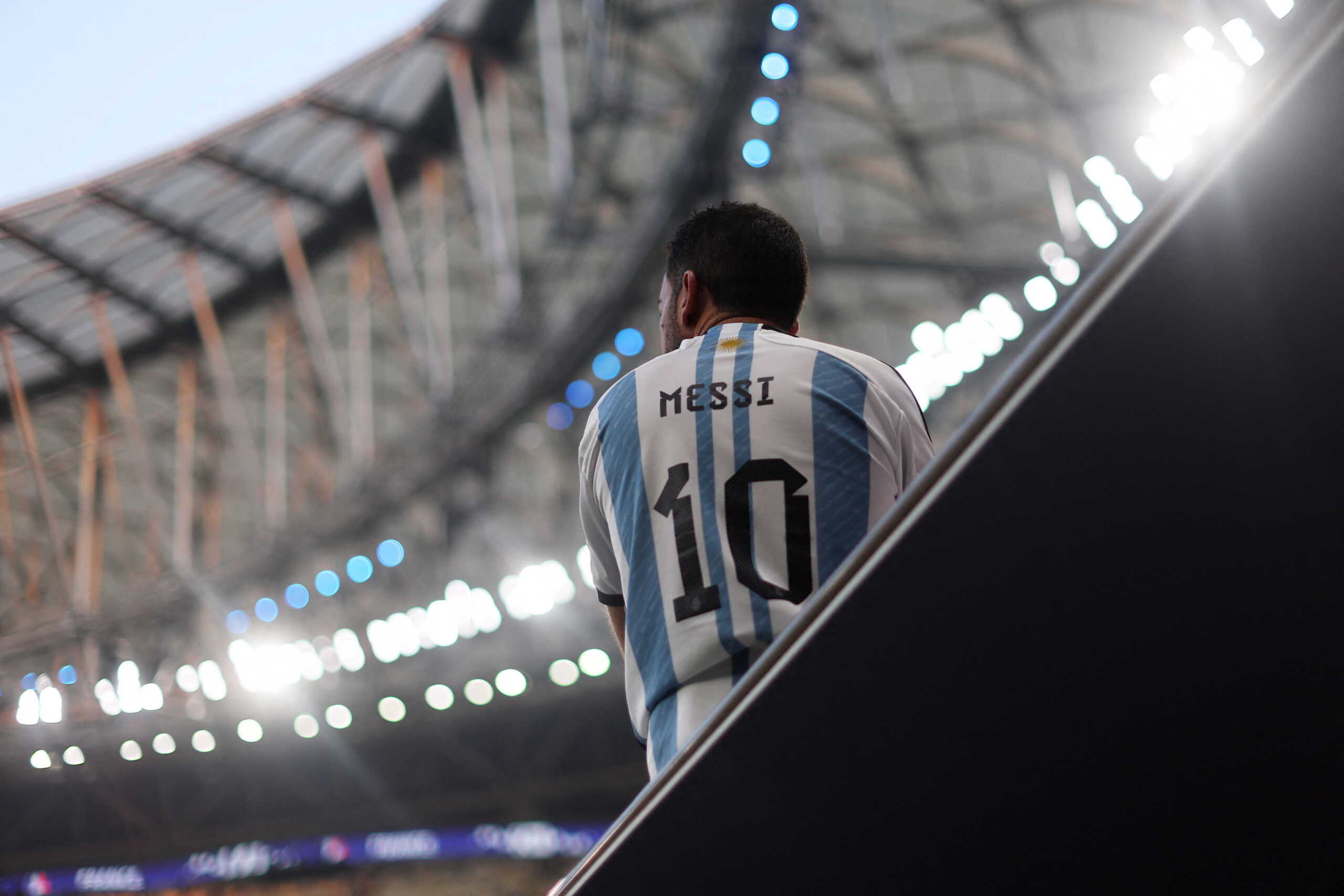 Soccer Football - FIFA World Cup Qatar 2022 - Final - Argentina v France - Lusail Stadium, Lusail, Qatar - December 18, 2022 An Argentina fan is pictured wearing a Lionel Messi shirt inside the stadium before the match REUTERS