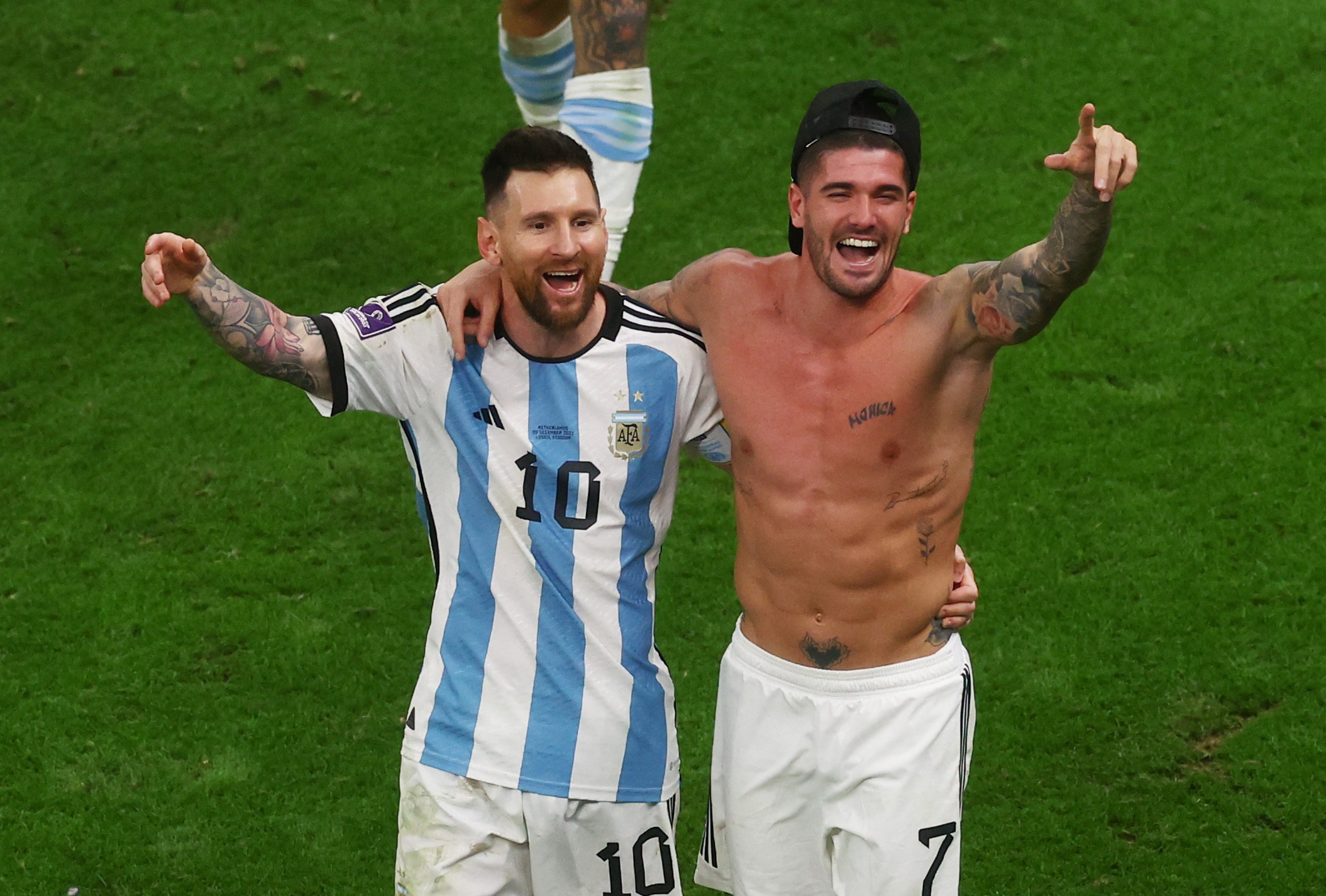 Soccer Football - FIFA World Cup Qatar 2022 - Quarter Final - Netherlands v Argentina - Lusail Stadium, Lusail, Qatar - December 10, 2022  Argentina's Rodrigo De Paul and Lionel Messi celebrate after the penalty shootout as Argentina progress to the semi finals REUTERS