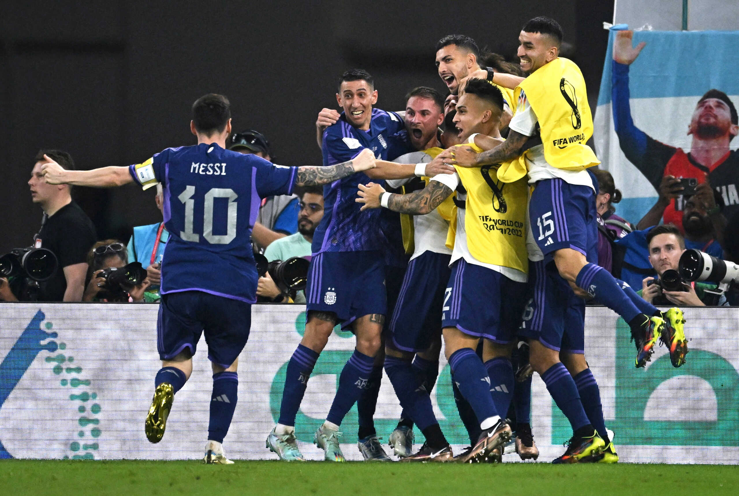 Soccer Football - FIFA World Cup Qatar 2022 - Group C - Poland v Argentina - Stadium 974, Doha, Qatar - November 30, 2022 Argentina's Alexis Mac Allister celebrates scoring their first goal with Angel Di Maria and Lionel Messi REUTERS