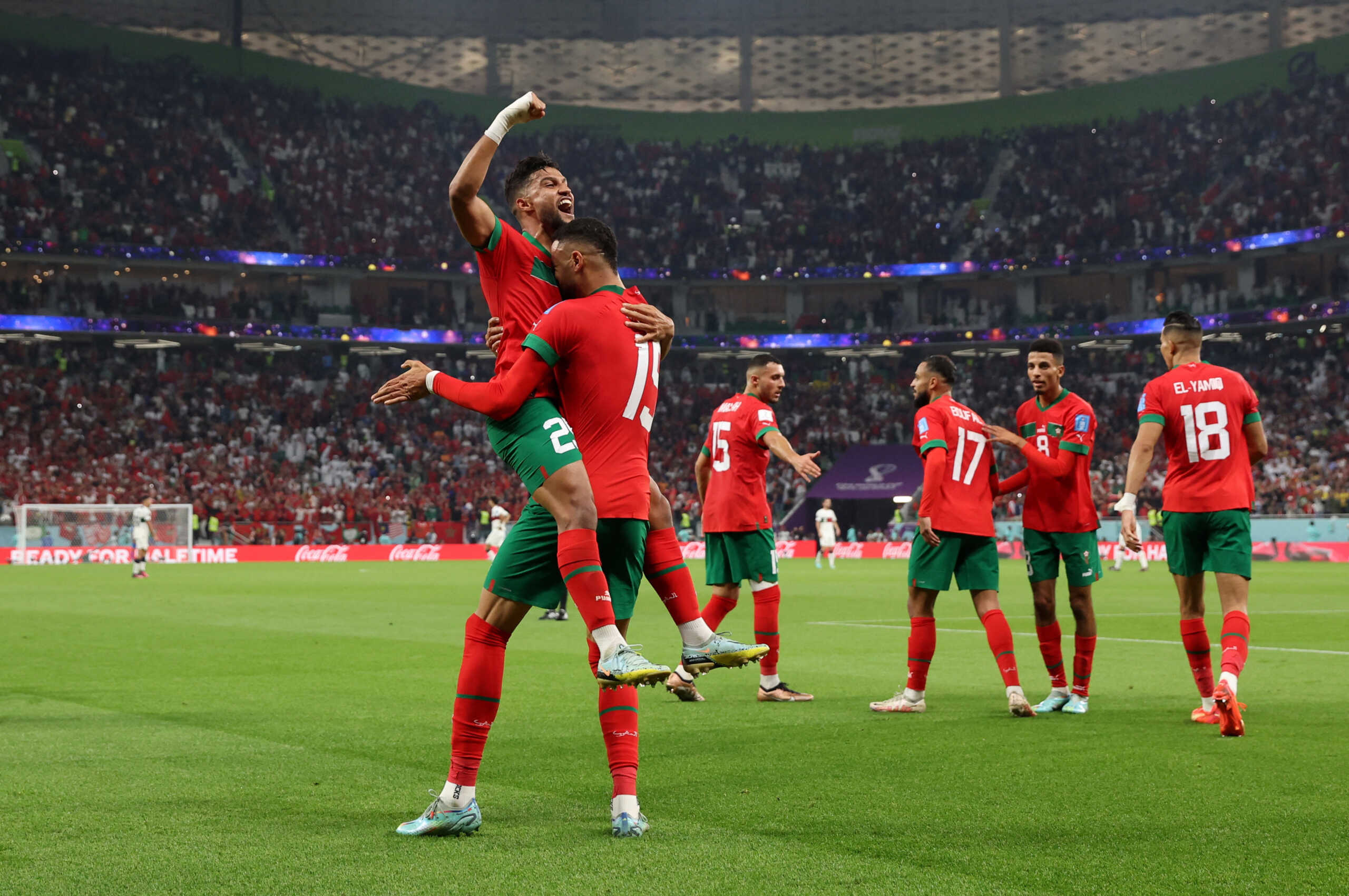Soccer Football - FIFA World Cup Qatar 2022 - Quarter Final - Morocco v Portugal - Al Thumama Stadium, Doha, Qatar - December 10, 2022 Morocco's Youssef En-Nesyri celebrates scoring their first goal with Yahya Attiat-Allah REUTERS