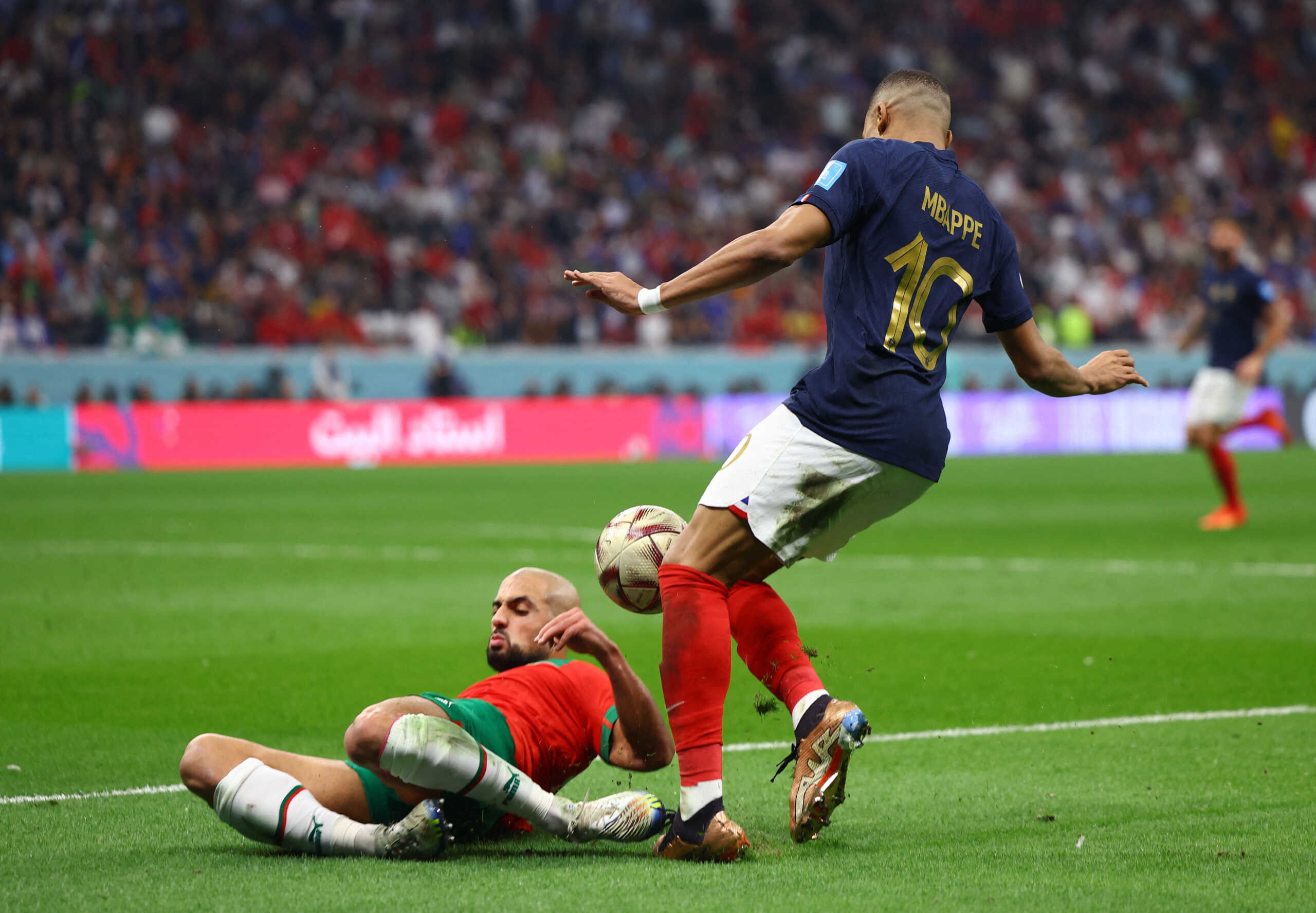 Soccer Football - FIFA World Cup Qatar 2022 - Semi Final - France v Morocco - Al Bayt Stadium, Al Khor, Qatar - December 14, 2022 France's Kylian Mbappe in action with Morocco's Sofyan Amrabat REUTERS