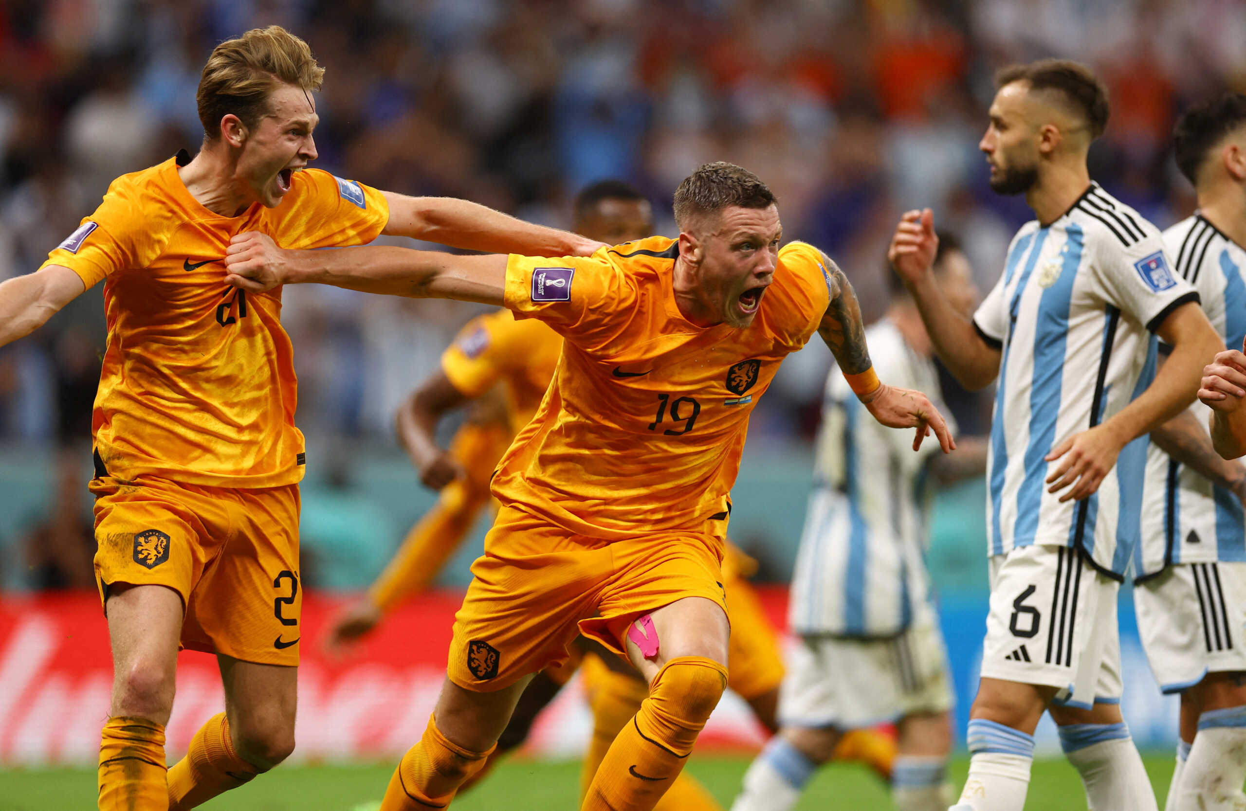 Soccer Football - FIFA World Cup Qatar 2022 - Quarter Final - Netherlands v Argentina - Lusail Stadium, Lusail, Qatar - December 9, 2022 Netherlands' Wout Weghorst celebrates scoring their second goal with Frenkie de Jong REUTERS