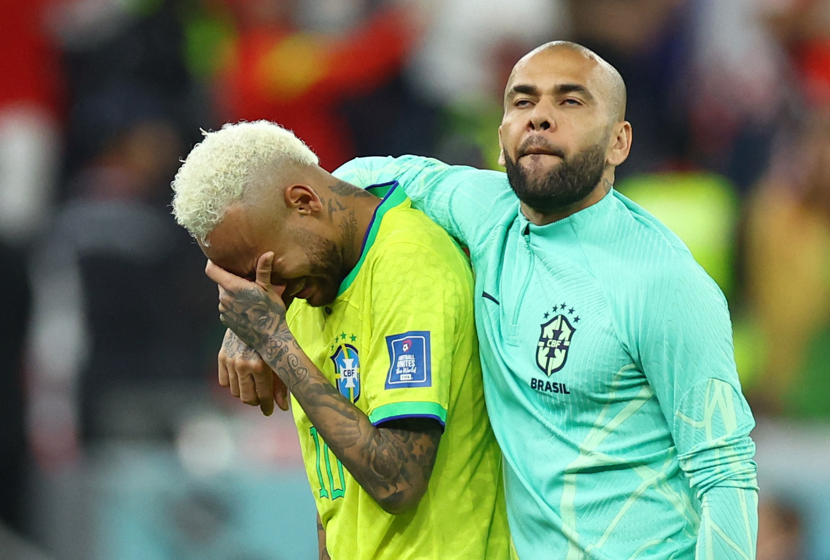 Soccer Football - FIFA World Cup Qatar 2022 - Quarter Final - Croatia v Brazil - Education City Stadium, Doha, Qatar - December 9, 2022 Brazil's Neymar and Dani Alves look dejected after losing the penalty shootout REUTERS