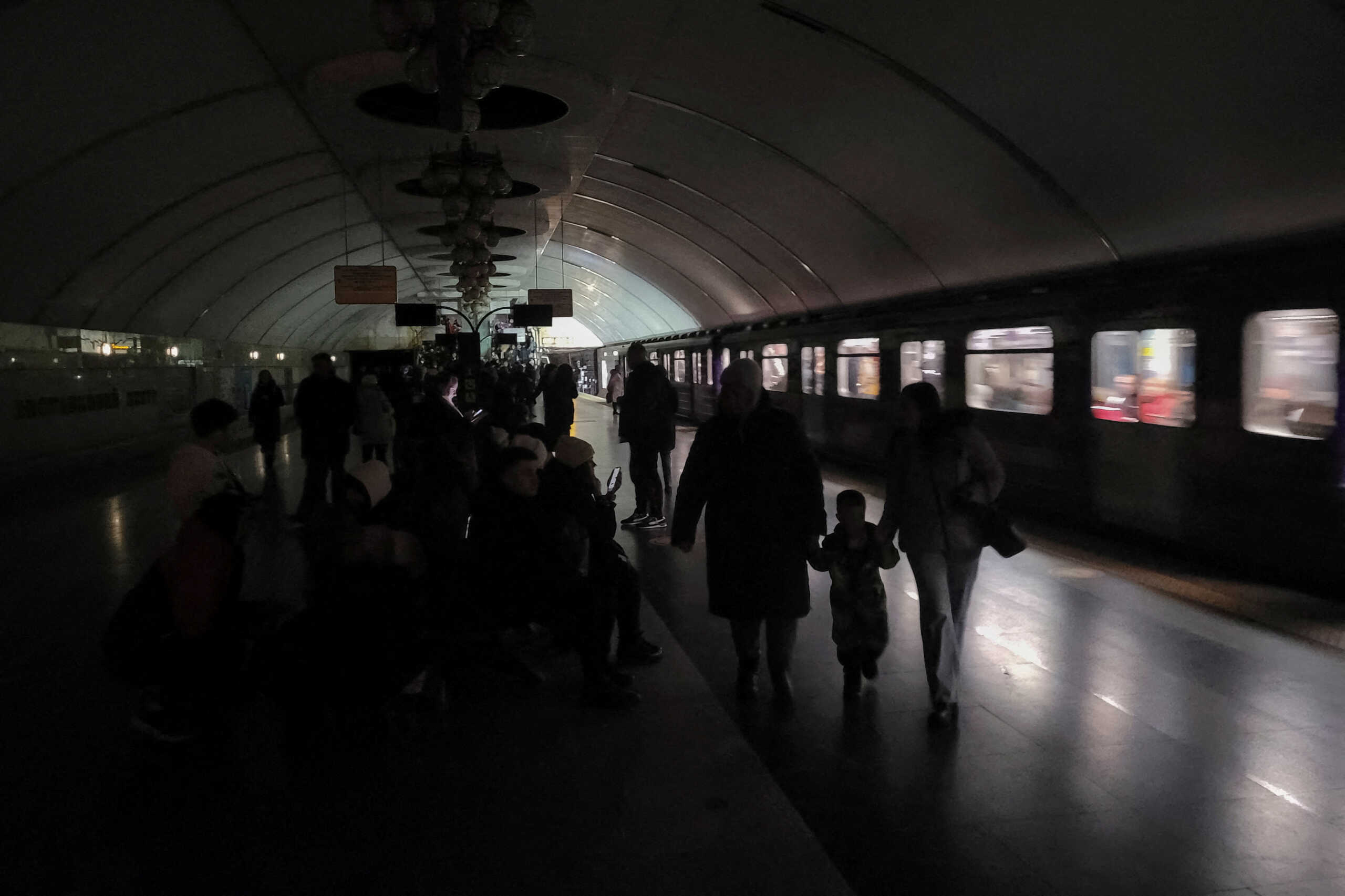 People shelter inside a metro station during partial power outage amid massive Russian missile attacks in Kyiv, Ukraine December 16, 2022. REUTERS