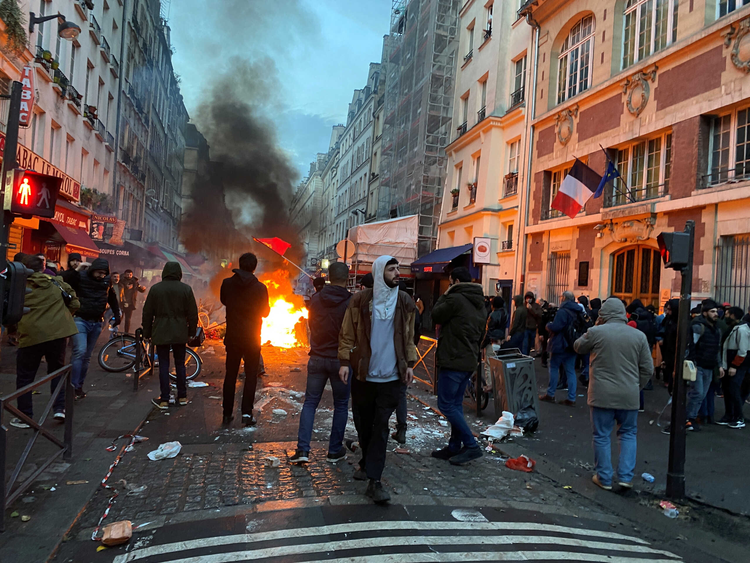 Protestors clash with French police during a demonstration near the Rue d'Enghien after gunshots were fired killing and injuring several people in a central district of Paris, France, December 23, 2022.  REUTERS