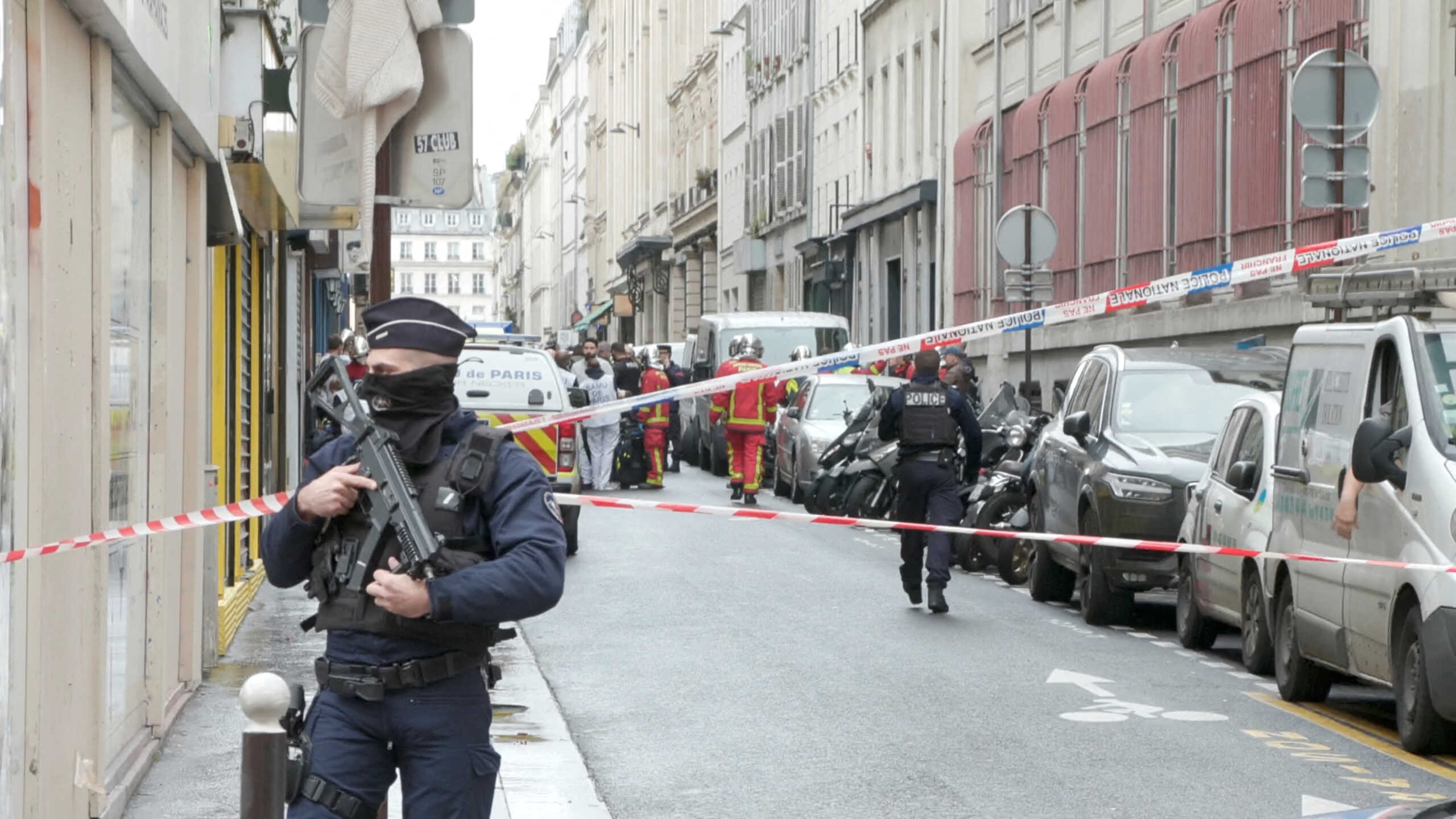 Members of emergency services work at the site where gunshots were fired in central Paris, France, December 23, 2022, in this still image obtained form a social media video. Clement Lanot