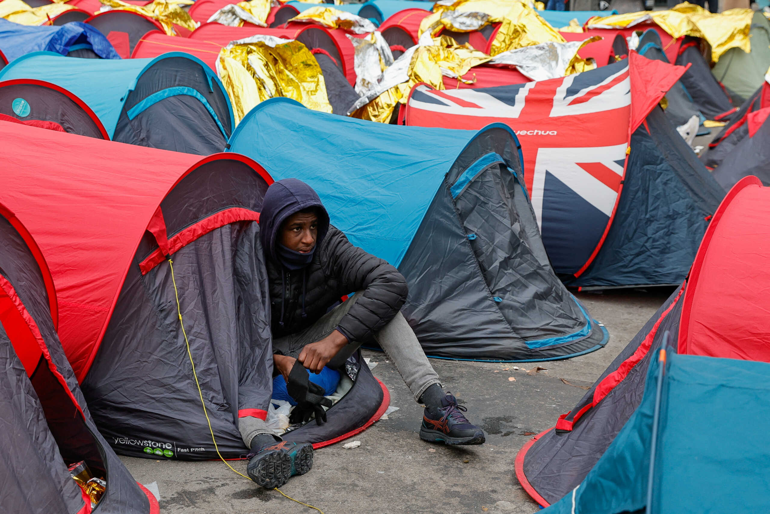 Minor migrants pitched tents in front of the French state council and stayed there since yesterday to protest the lack of housing, in Paris, France, December 4, 2022. REUTERS
