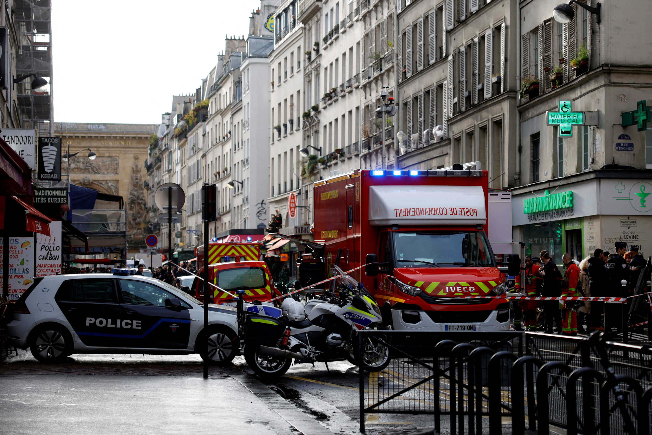 FILE PHOTO: French police and firefighters secure a street after gunshots were fired, killing two people and injuring several, in a central district of Paris, France, December 23, 2022.  REUTERS