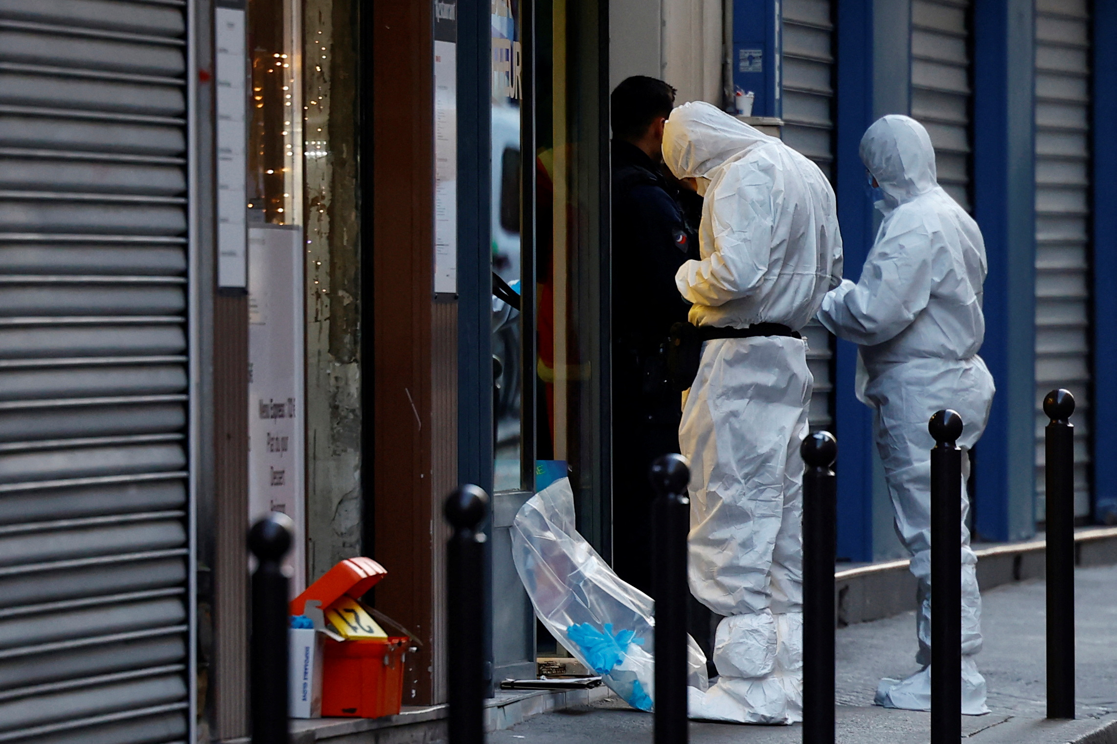 French scientific police work on Rue d'Enghien after gunshots were fired killing and injuring several people in a central district of Paris, France, December 23, 2022.  REUTERS