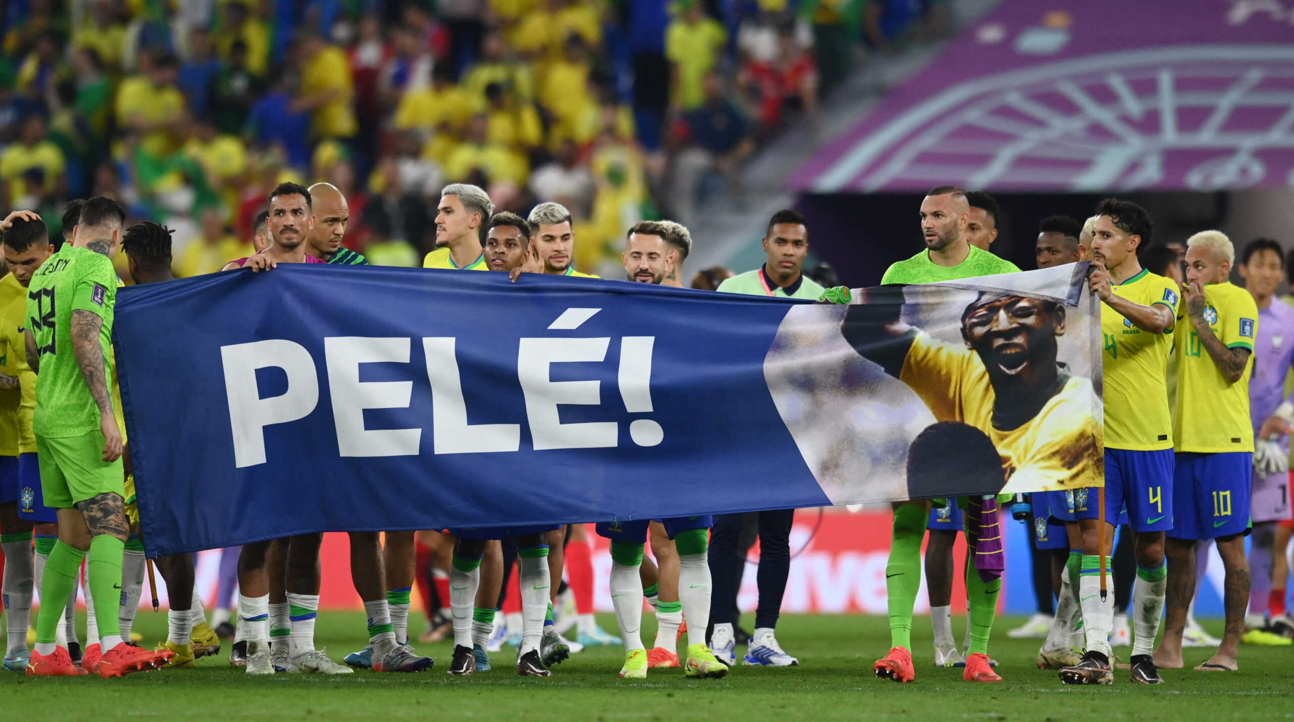 Soccer Football - FIFA World Cup Qatar 2022 - Round of 16 - Brazil v South Korea - Stadium 974, Doha, Qatar - December 5, 2022 Brazil players hold a banner of former Brazil player Pele after the match REUTERS