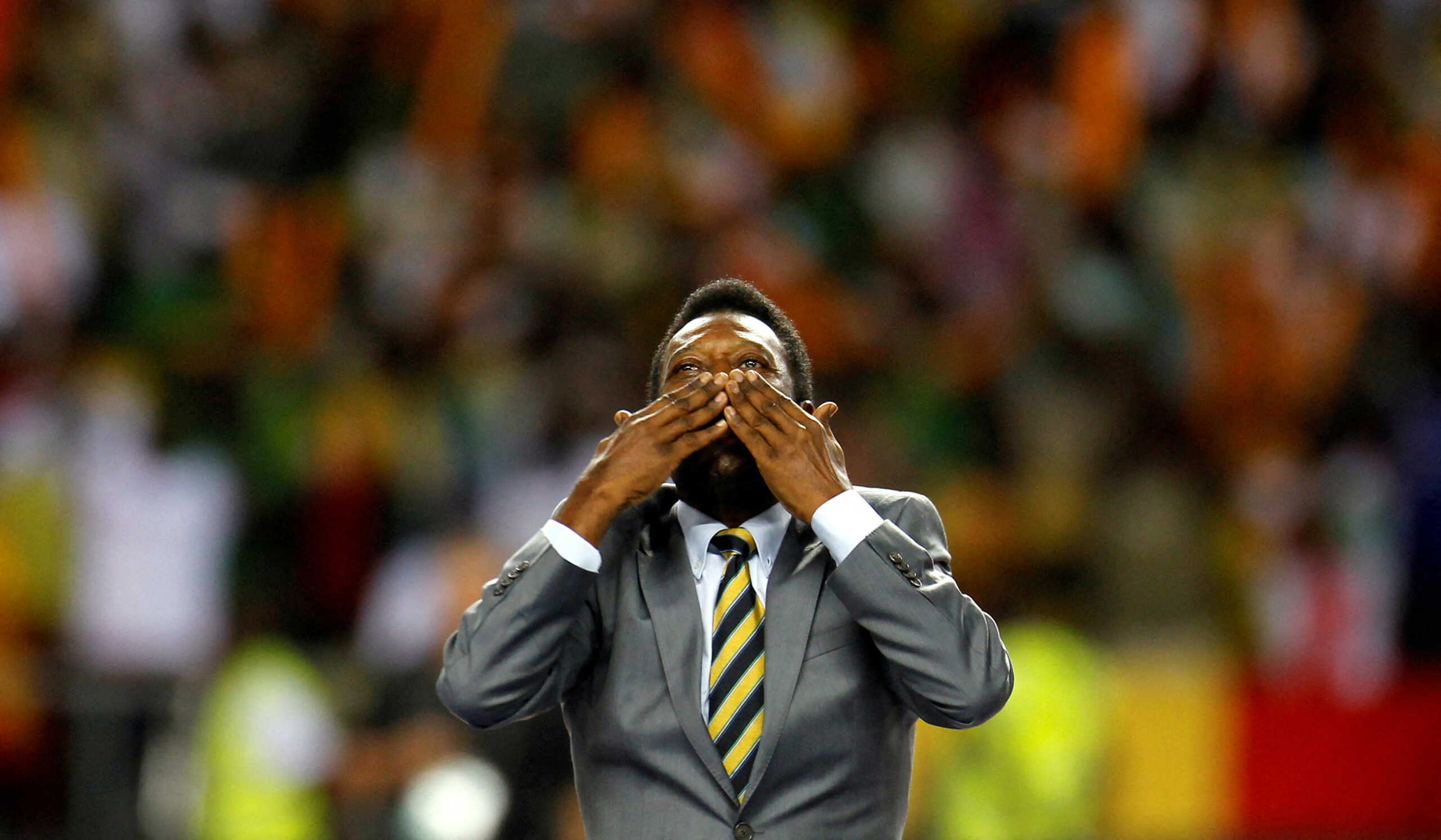 FILE PHOTO: Brazil's soccer legend Pele acknowledges the crowd before the 2012 African Cup of Nations semi-final soccer match between Ivory Coast and Mali in Stade De L'Amitie Stadium in Libreville, Gabon, February 8, 2012. REUTERS