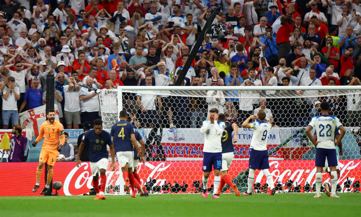 Soccer Football - FIFA World Cup Qatar 2022 - Quarter Final - England v France - Al Bayt Stadium, Al Khor, Qatar - December 10, 2022 England's Harry Kane looks dejected after missing a penalty as France's Hugo Lloris celebrates with teammates REUTERS