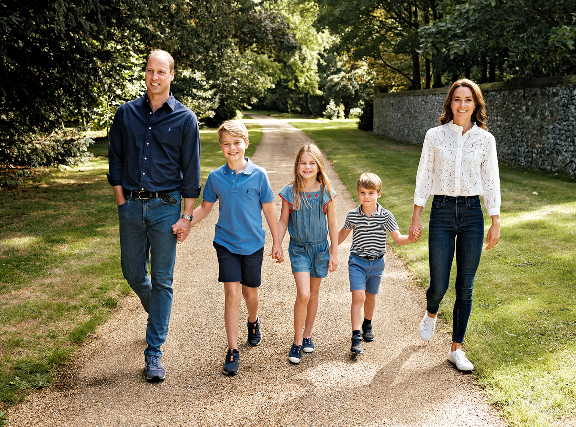 Britain's Prince William, Prince of Wales, Catherine, Princess of Wales and their children Prince George, Princess Charlotte and Prince Louis walk in Norfolk on this undated photo released as a Christmas card on December 13, 2022. Matt Porteous