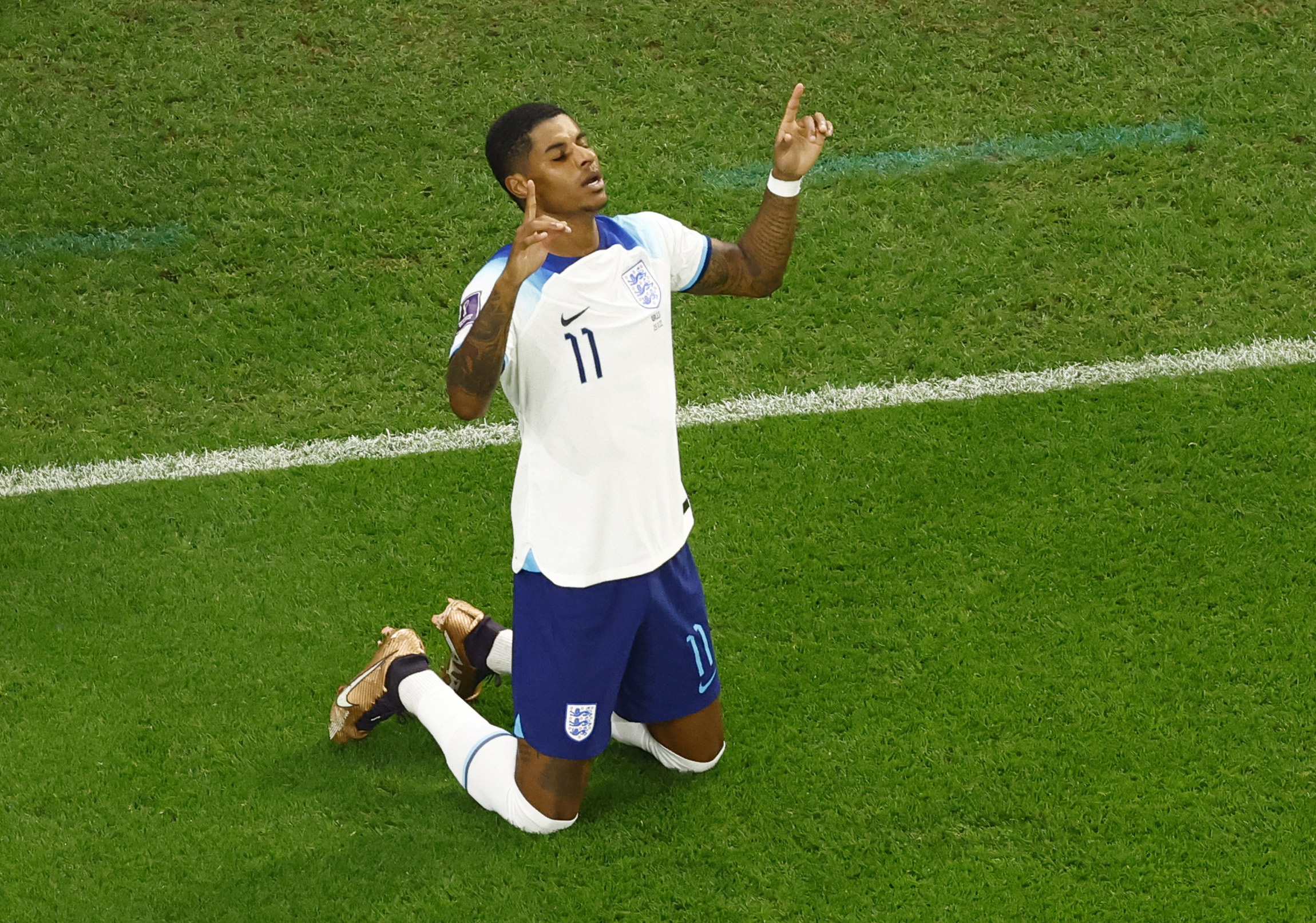 Soccer Football - FIFA World Cup Qatar 2022 - Group B - Wales v England - Ahmad Bin Ali Stadium, Al Rayyan, Qatar - November 29, 2022 England's Marcus Rashford celebrates scoring their first goal REUTERS