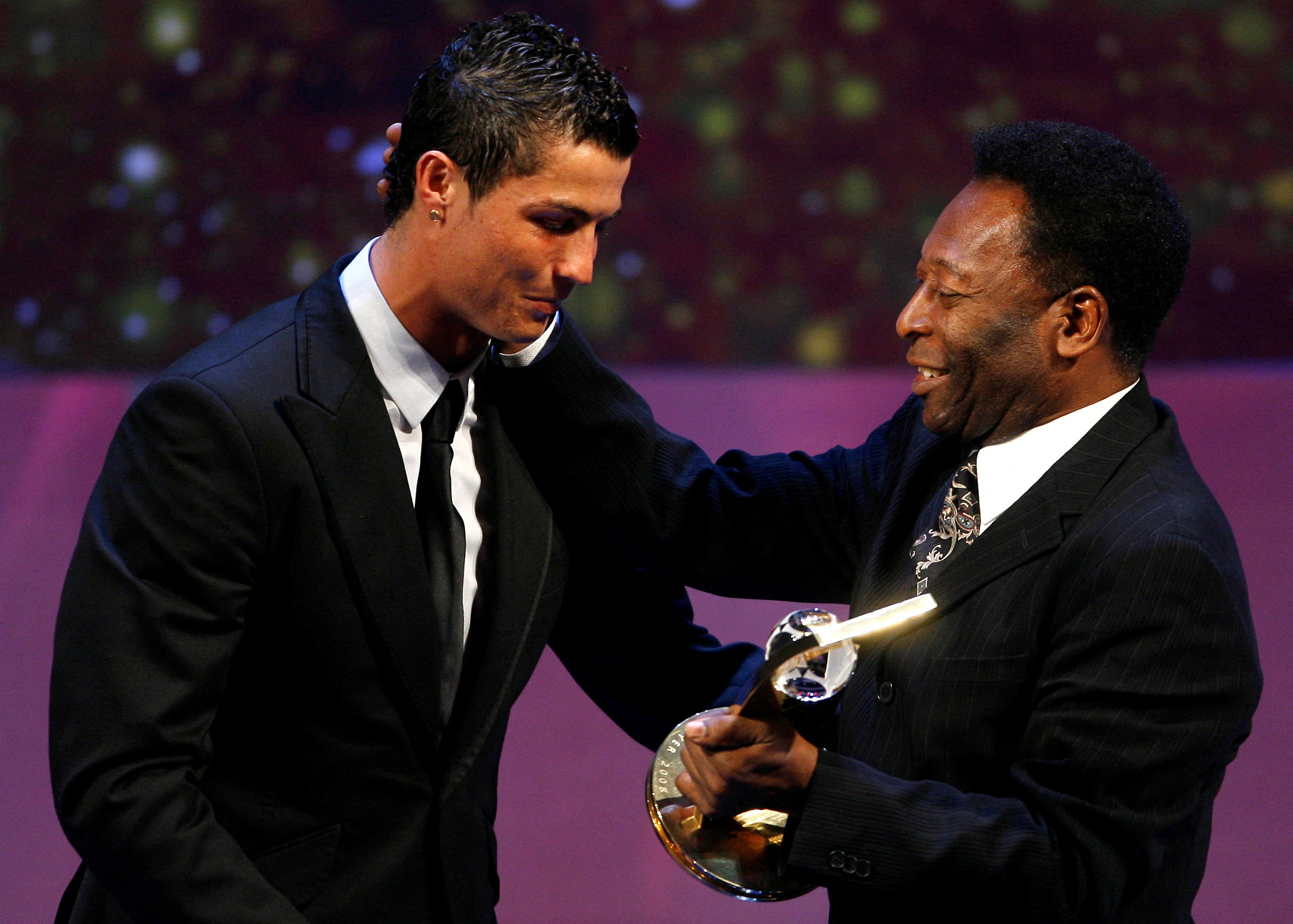 FILE PHOTO: Cristiano Ronaldo of Portugal receives the FIFA World Player 2008 award from soccer legend Pele during the FIFA World Player of the Year awards ceremony in Zurich, Switzerland, January 12, 2009.   REUTERS