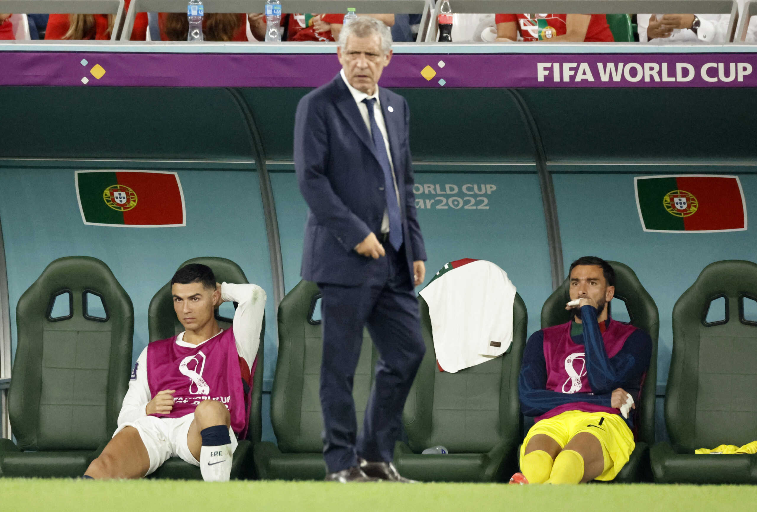 Soccer Football - FIFA World Cup Qatar 2022 - Group H - South Korea v Portugal - Education City Stadium, Al Rayyan, Qatar - December 2, 2022  Portugal's Cristiano Ronaldo and Rui Patricio on the substitutes bench as Portugal coach Fernando Santos looks on REUTERS