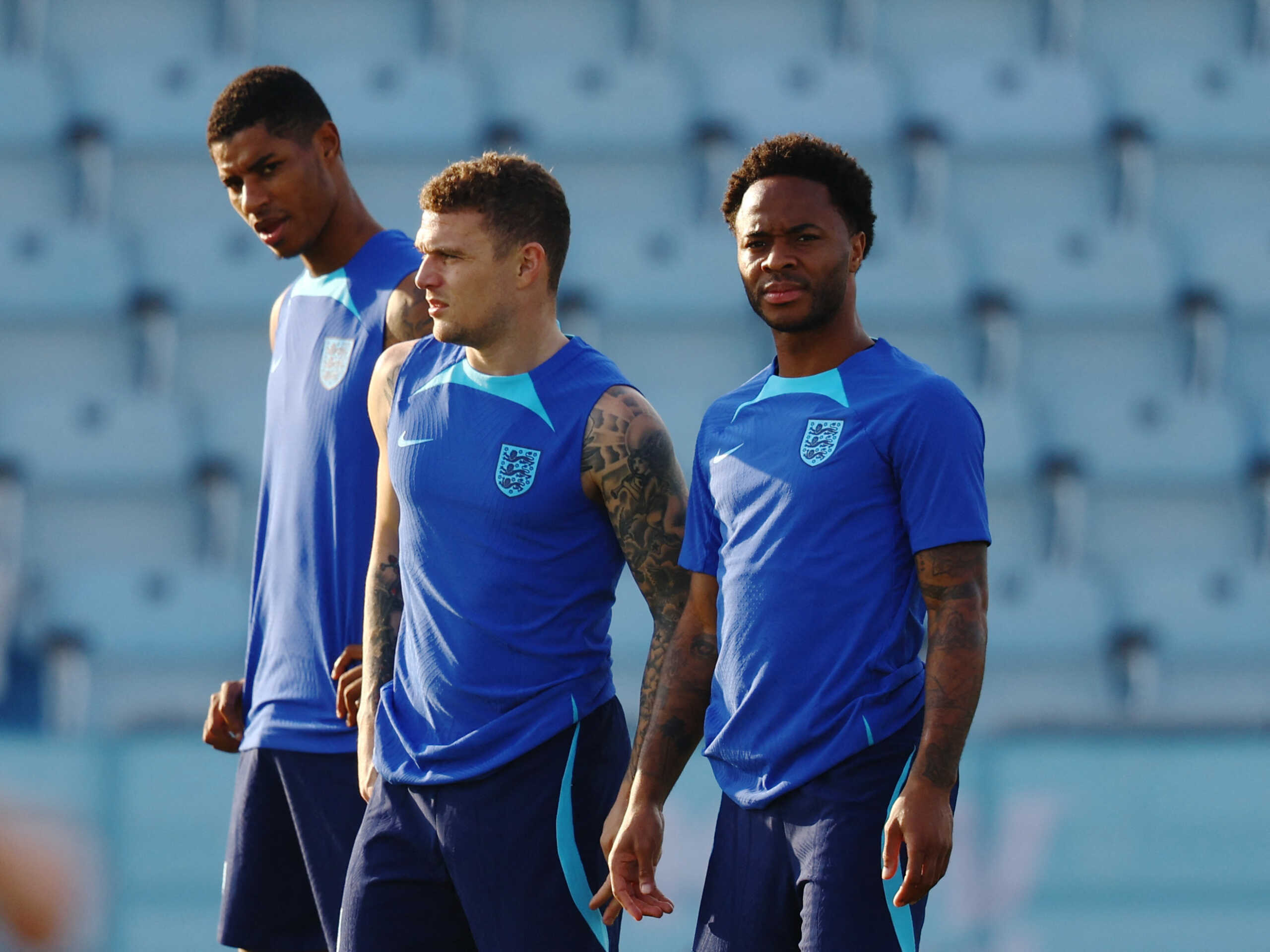 Soccer Football - FIFA World Cup Qatar 2022 - England Training - Al Wakrah SC stadium, Al Wakrah, Qatar - December 3, 2022 England's Marcus Rashford, Kieran Trippier and Raheem Sterling during training REUTERS