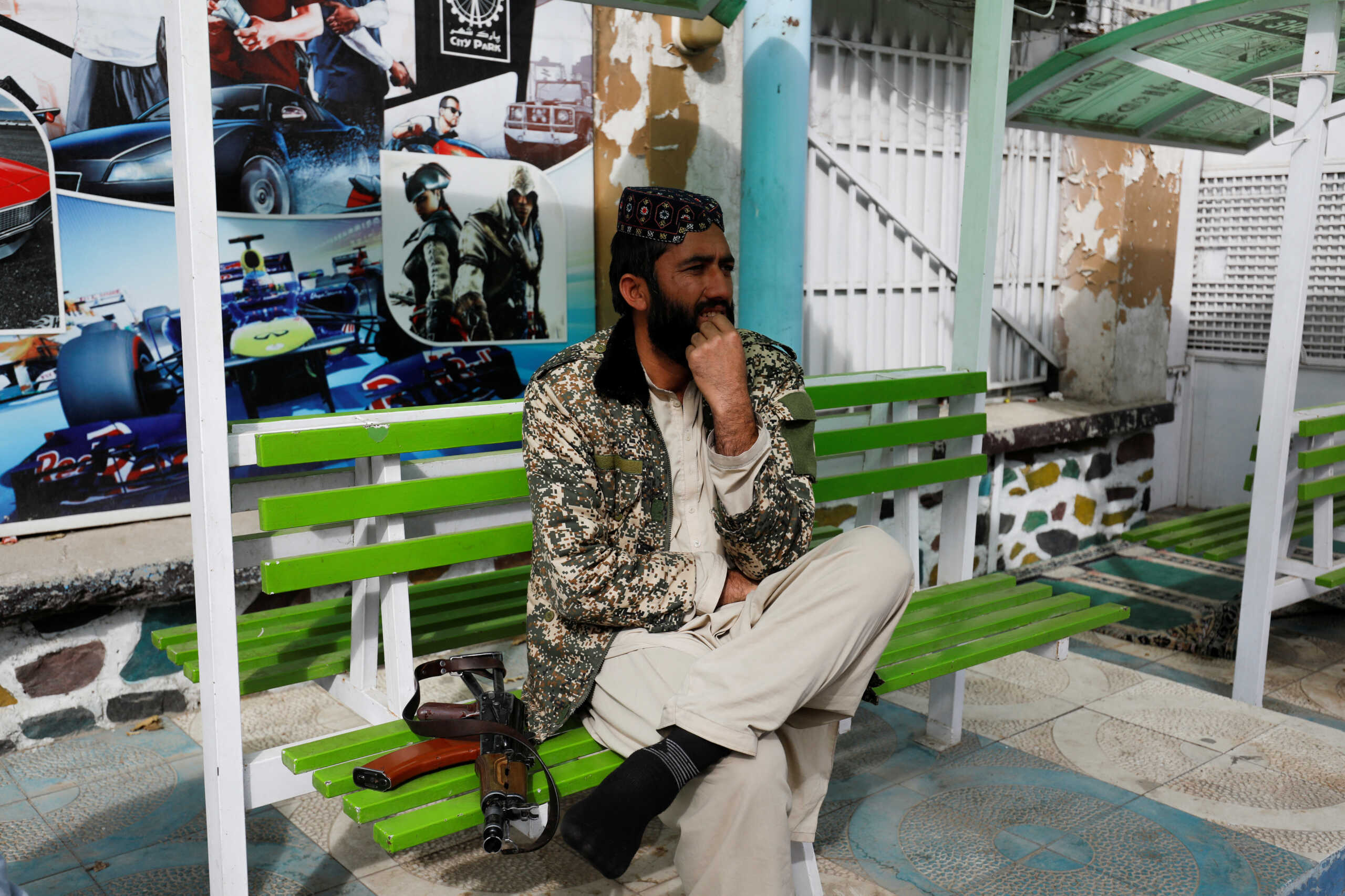 A Taliban fighter stands guard in an amusement park in Kabul, Afghanistan, November 9, 2022. REUTERS