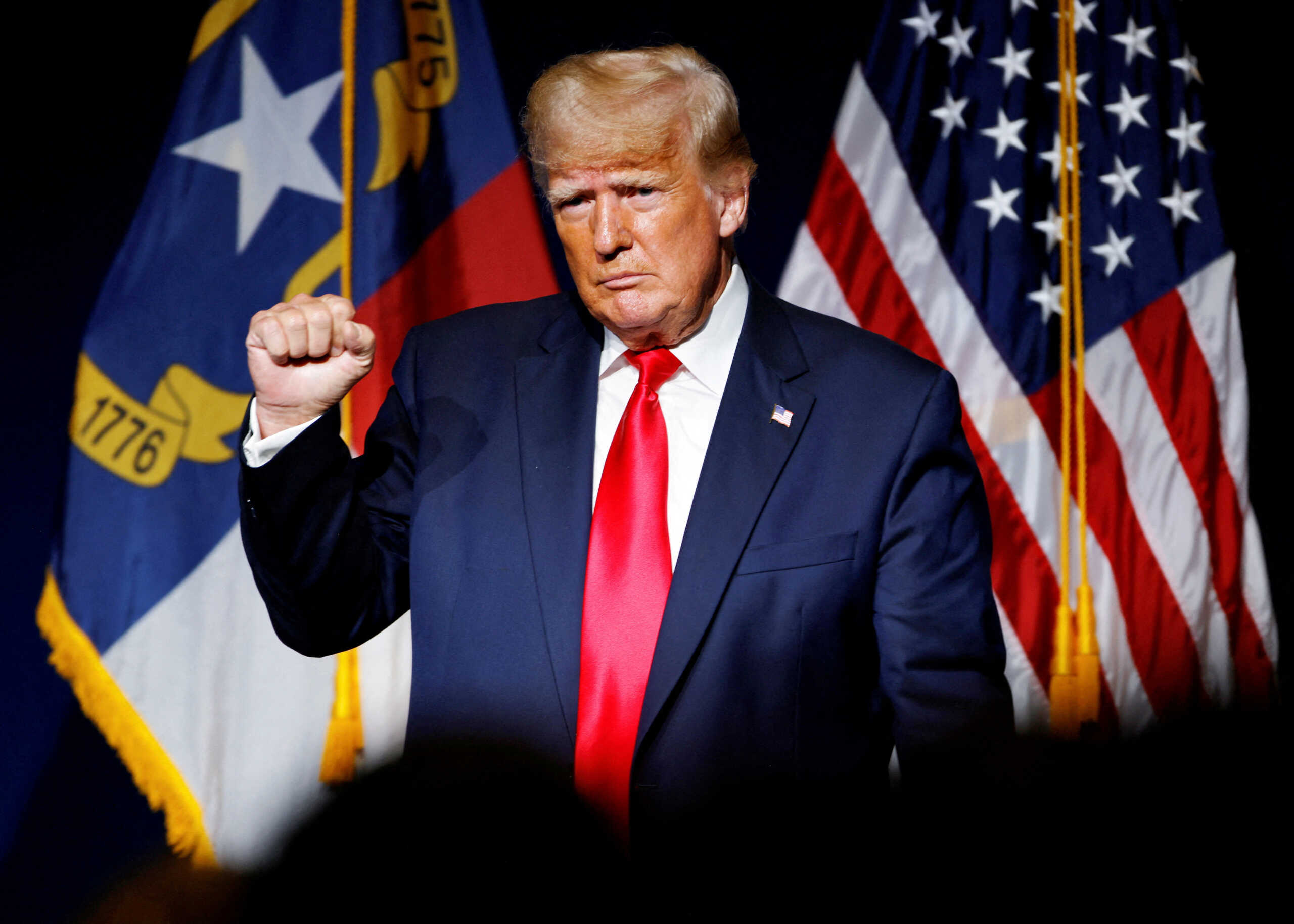 FILE PHOTO: Former U.S. President Donald Trump makes a fist while reacting to applause after speaking at the North Carolina GOP convention dinner in Greenville, North Carolina, U.S. June 5, 2021.  REUTERS