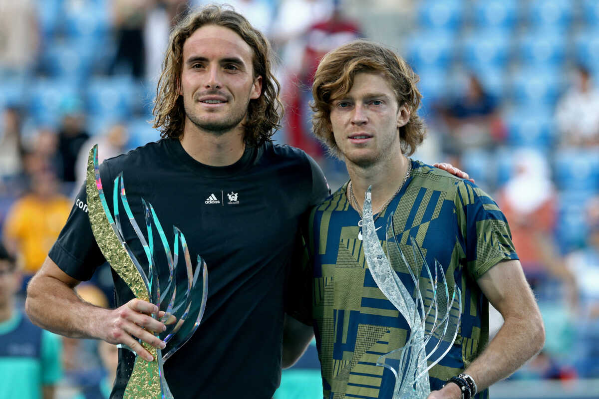 Tennis - Mubadala World Tennis Championship - International Tennis Centre, Zayed Sports City, Abu Dhabi, United Arab Emirates - December 18, 2022 Greece's Stefanos Tsitsipas poses with the trophy after winning the final alongside runner up Russia's Andrey Rublev REUTERS