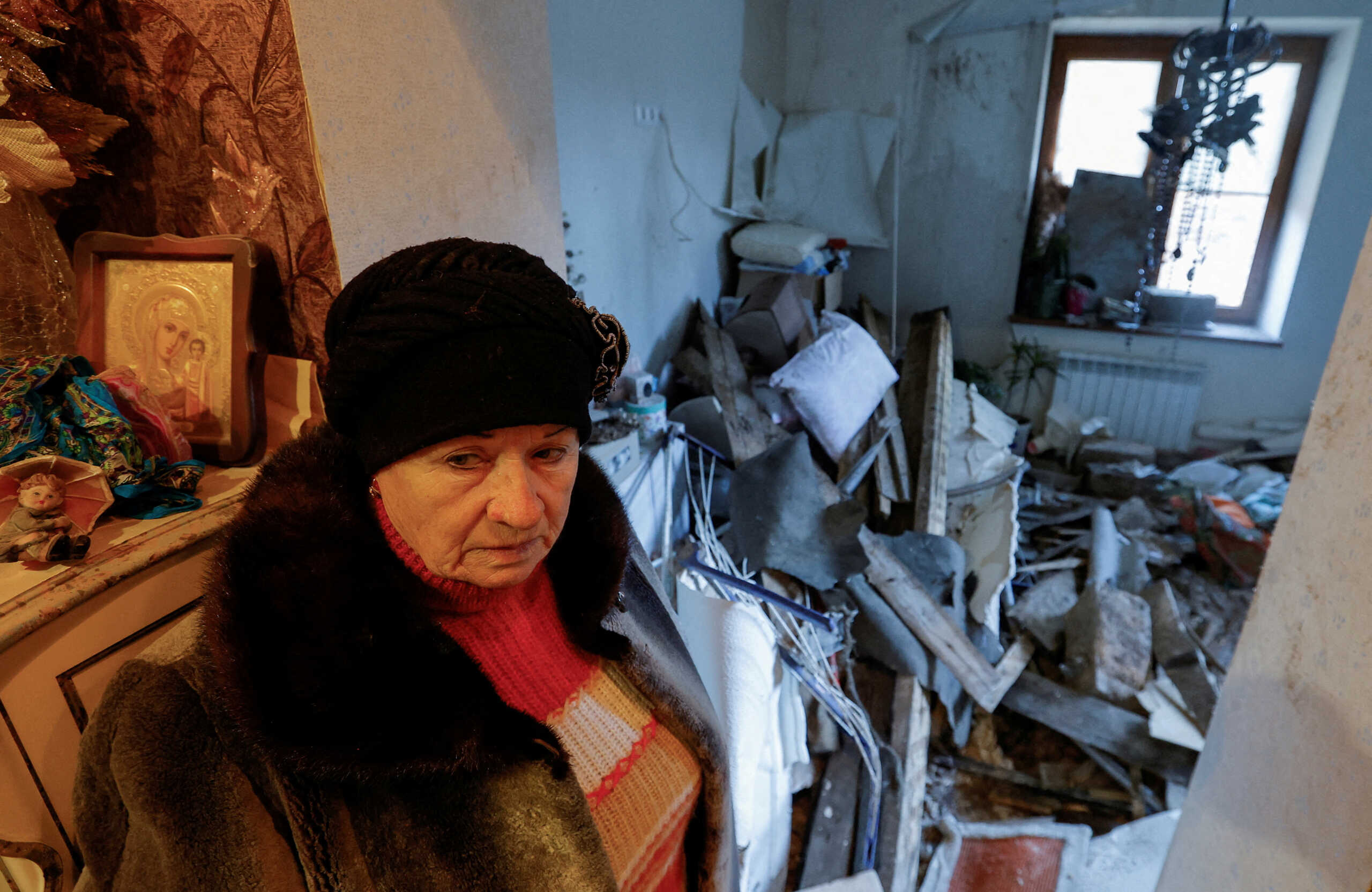 FILE PHOTO: Local resident Lyudmila, 70, shows her apartment inside a house heavily damaged in recent shelling in the course of Russia-Ukraine conflict in Donetsk, Russian-controlled Ukraine, December 6, 2022. REUTERS