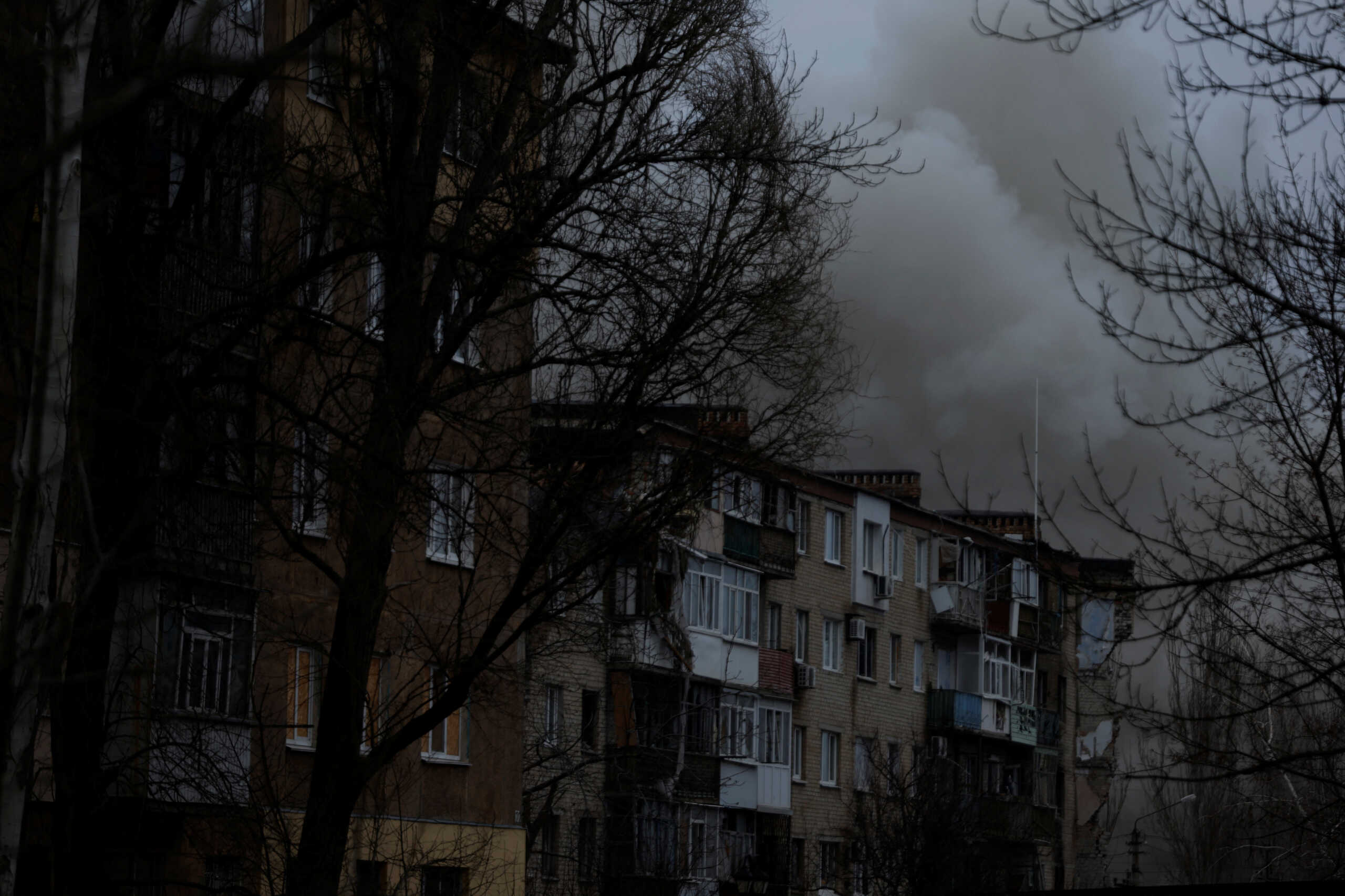 Smoke rises from apartment buildings damaged from missile strikes, as Russia's attack on Ukraine continues, during intense shelling on Christmas Day at the frontline in Bakhmut, Ukraine, December 25, 2022. REUTERS