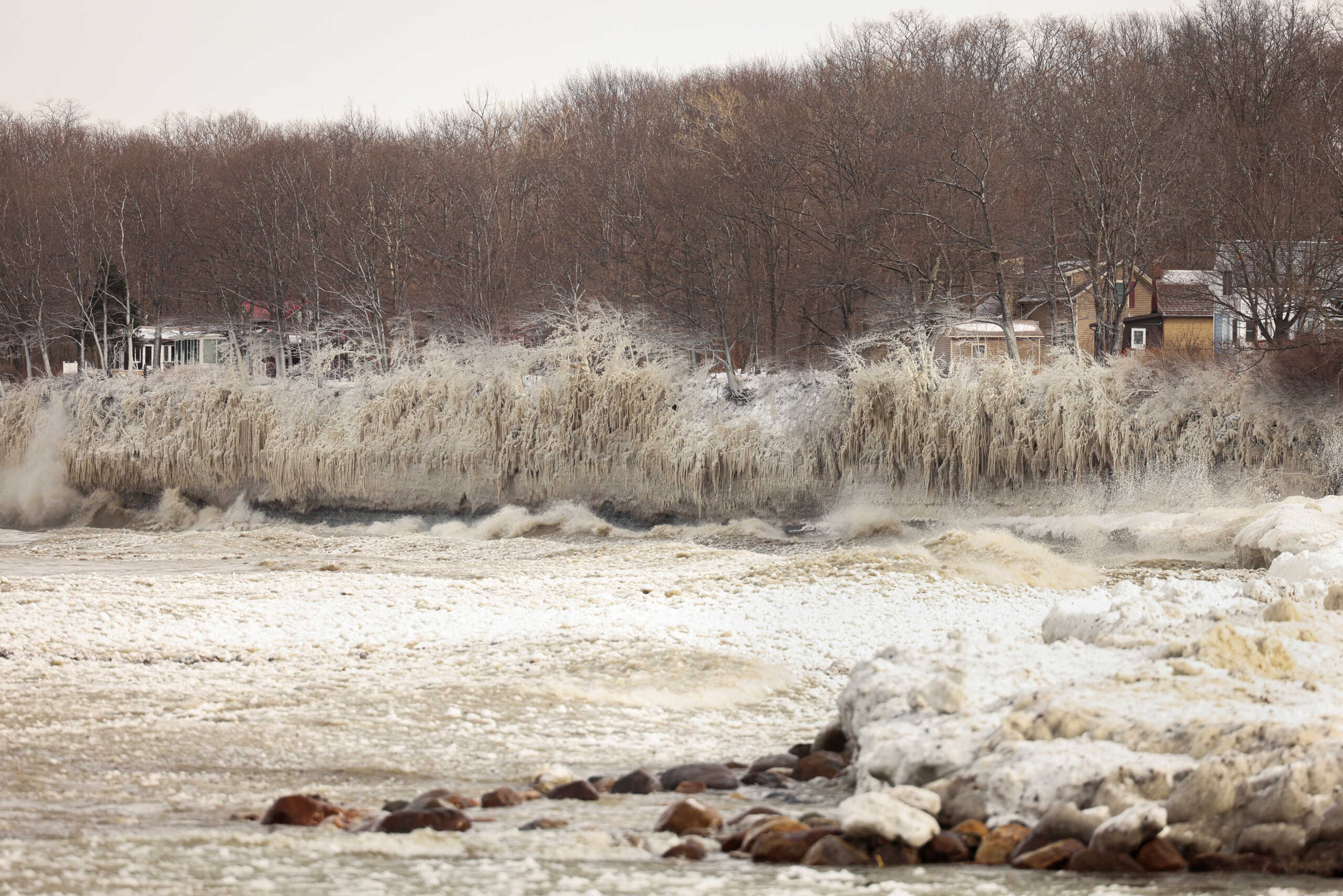 Ice forms by the spray of Lake Erie waves during a winter storm in Silver Creek, New York, U.S., December 24, 2022. REUTERS