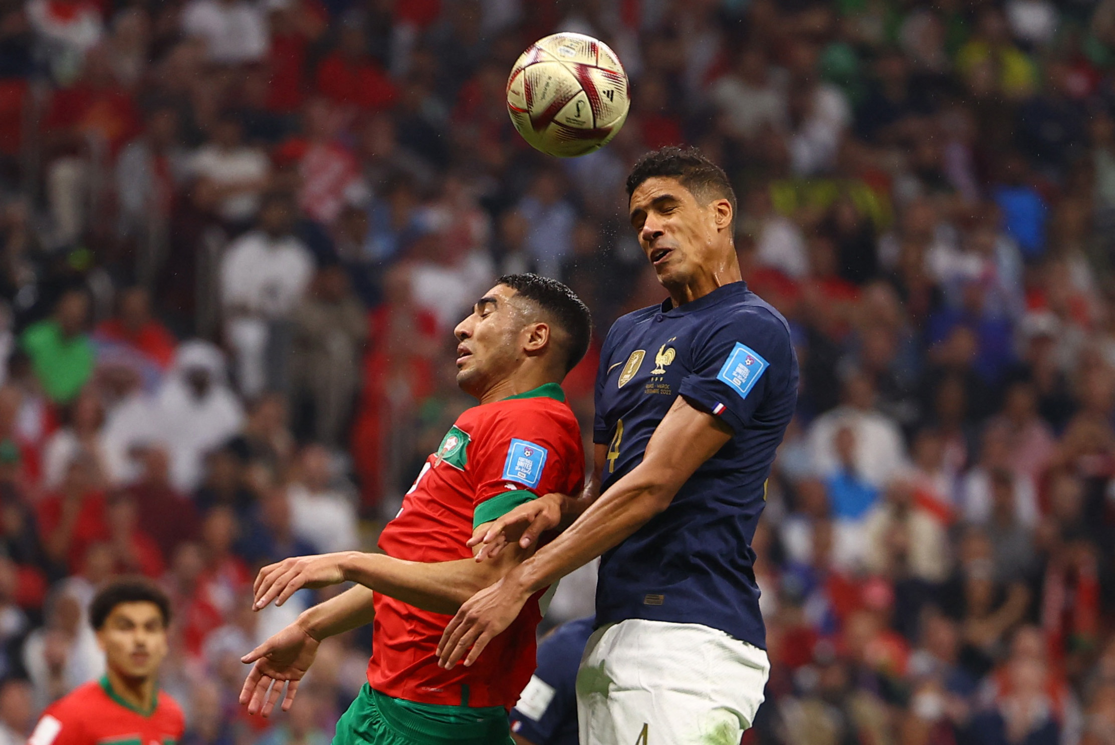 Soccer Football - FIFA World Cup Qatar 2022 - Semi Final - France v Morocco - Al Bayt Stadium, Al Khor, Qatar - December 14, 2022 France's Raphael Varane in action with Morocco's Achraf Hakimi REUTERS