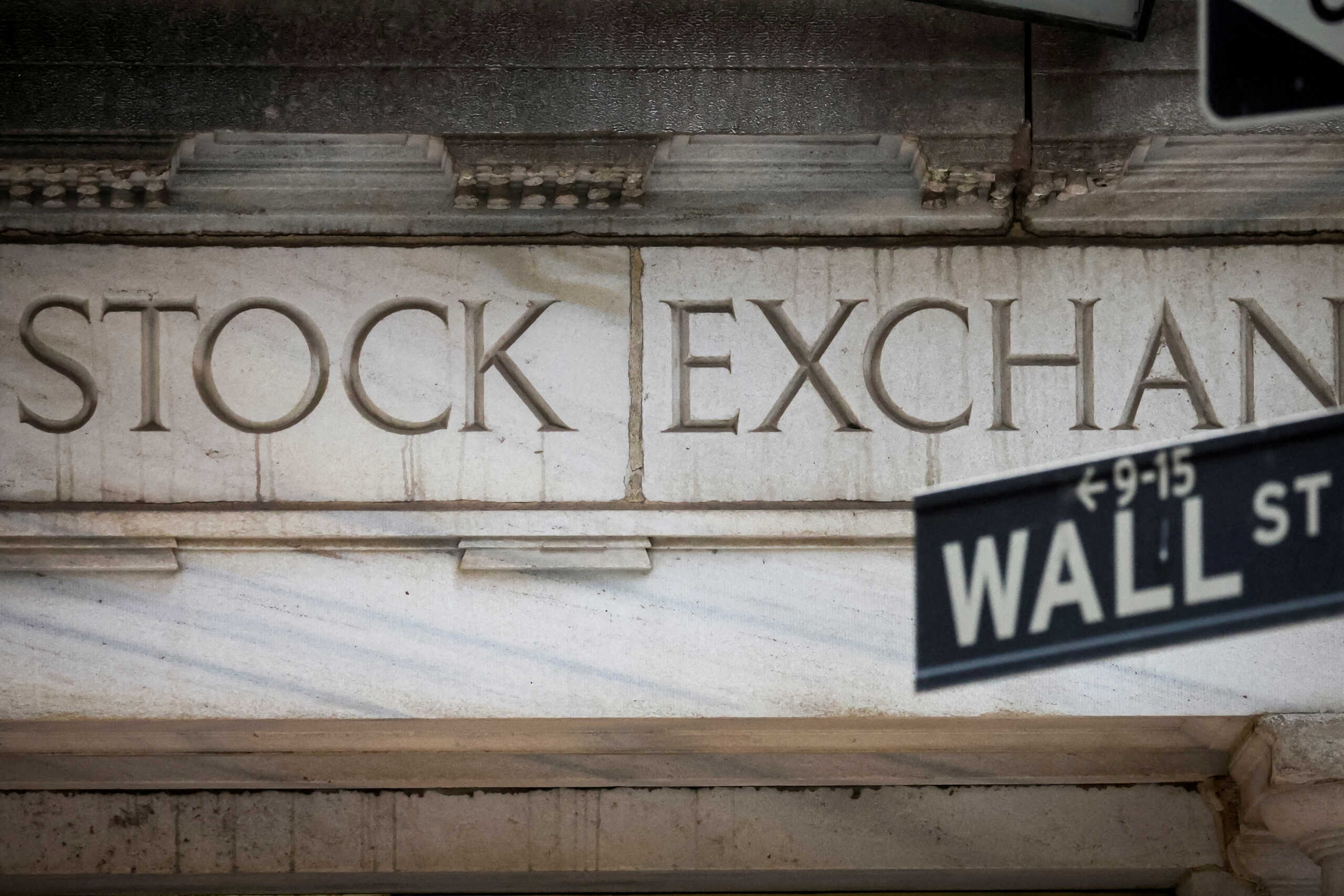FILE PHOTO: The Wall Street entrance to the New York Stock Exchange (NYSE) is seen in New York City, U.S., November 15, 2022. REUTERS