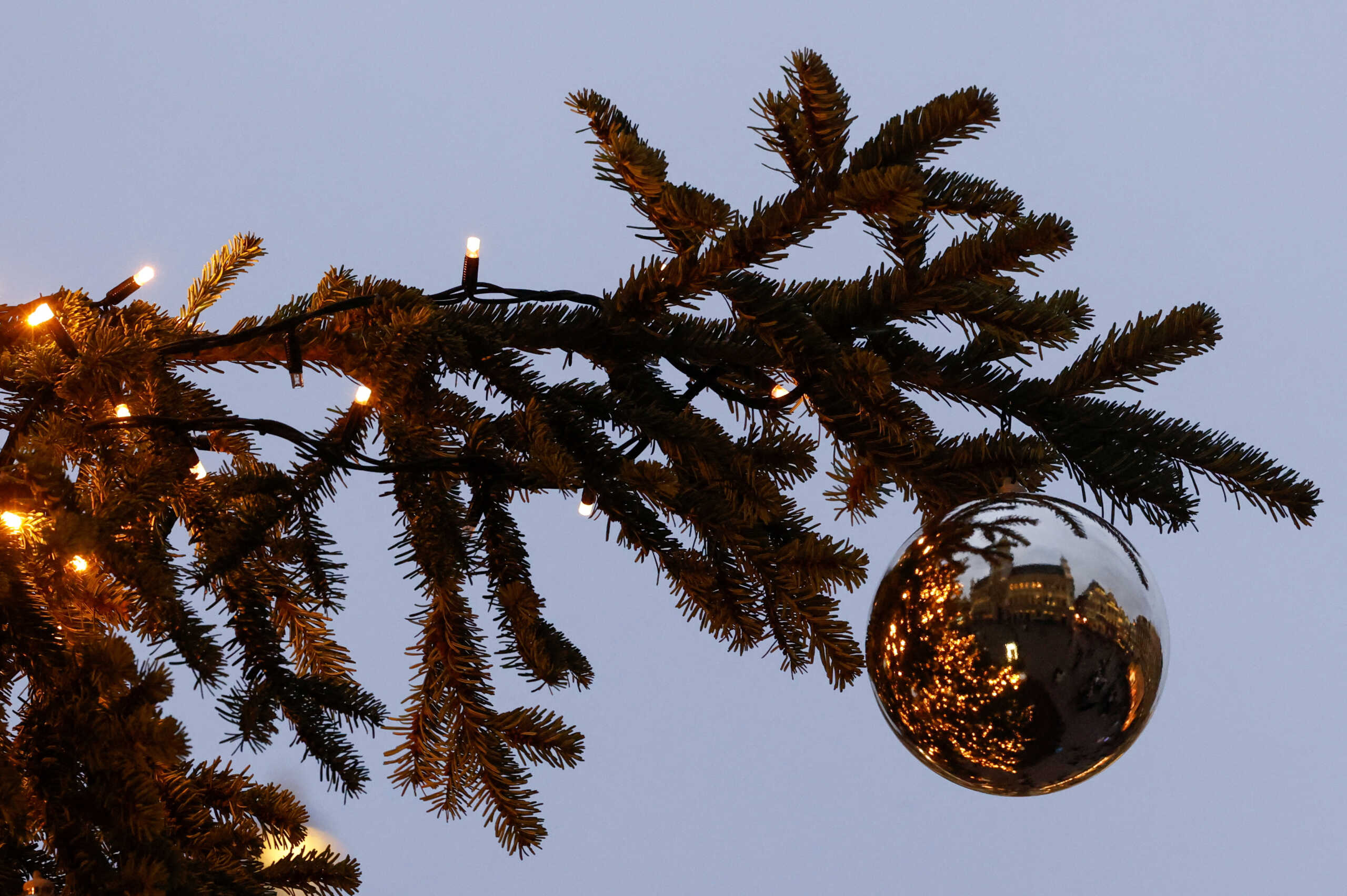 Brussels' Grand Place is reflected in a bauble hanging from a Christmas tree, as part of the Christmas festivities in central Brussels, Belgium, December 1, 2022. REUTERS