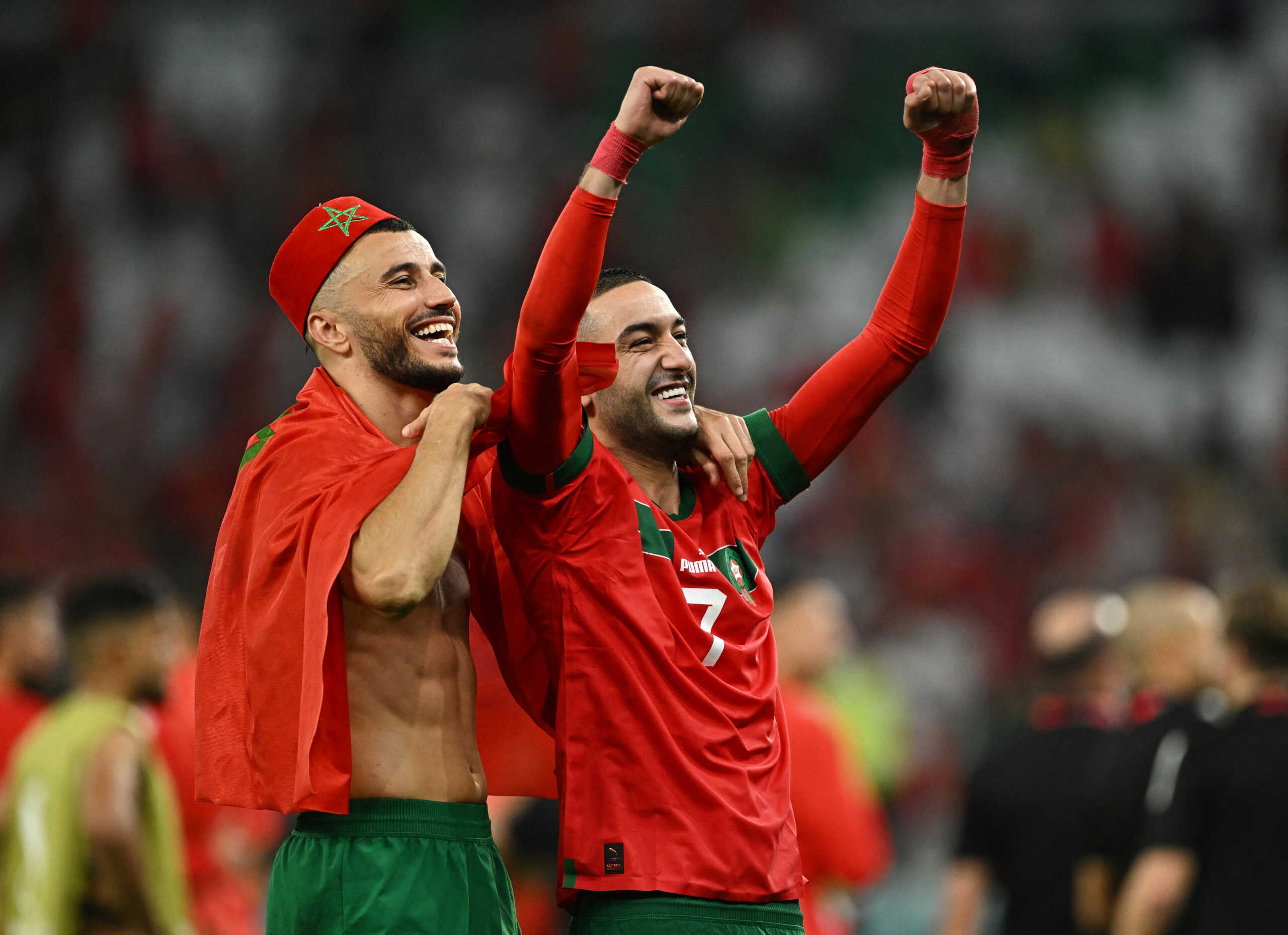 Soccer Football - FIFA World Cup Qatar 2022 - Round of 16 - Morocco v Spain - Education City Stadium, Al Rayyan, Qatar - December 6, 2022 Morocco's Hakim Ziyech celebrates with Romain Saiss after the penalty shootout as Morocco progress to the quarter finals REUTERS