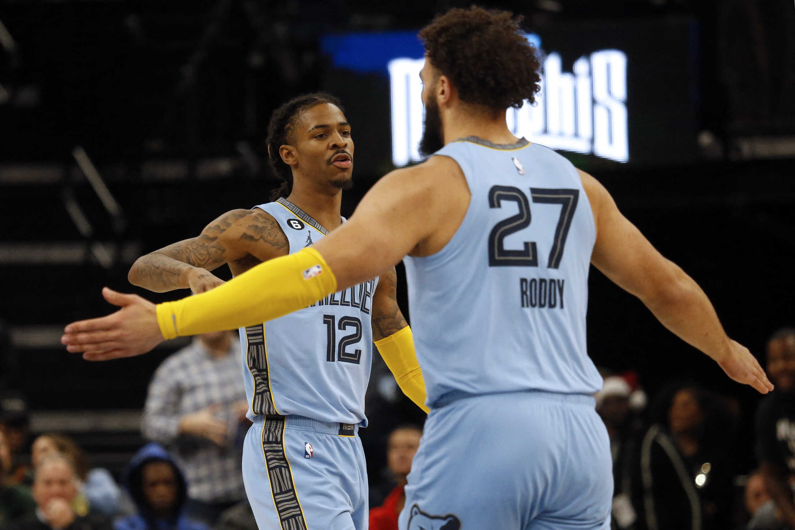 Dec 15, 2022; Memphis, Tennessee, USA; Memphis Grizzlies guard Ja Morant (12) reacts with forward David Roddy (27) during the first half against the Milwaukee Bucks at FedExForum. Mandatory Credit: Petre Thomas-USA TODAY Sports