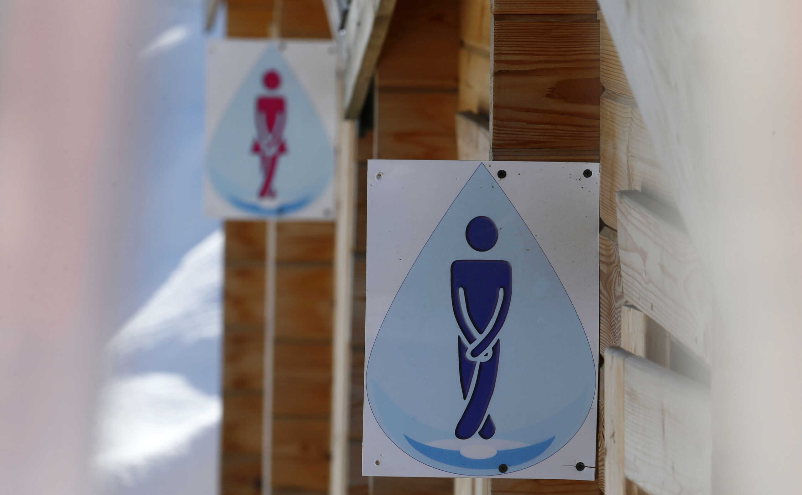 Unique toilet signs are seen near the alpine slopes of Rosa Khutor, a venue for the Sochi 2014 Winter Olympics, near Sochi February 14, 2013. Although many complexes and venues in the Black Sea resort of Sochi mostly resemble building sites that are still under construction, there is nothing to suggest any concern over readiness. Construction will be completed by August 2013 according to organizers. The Sochi 2014 Winter Olympics opens on February 7, 2014. REUTERS