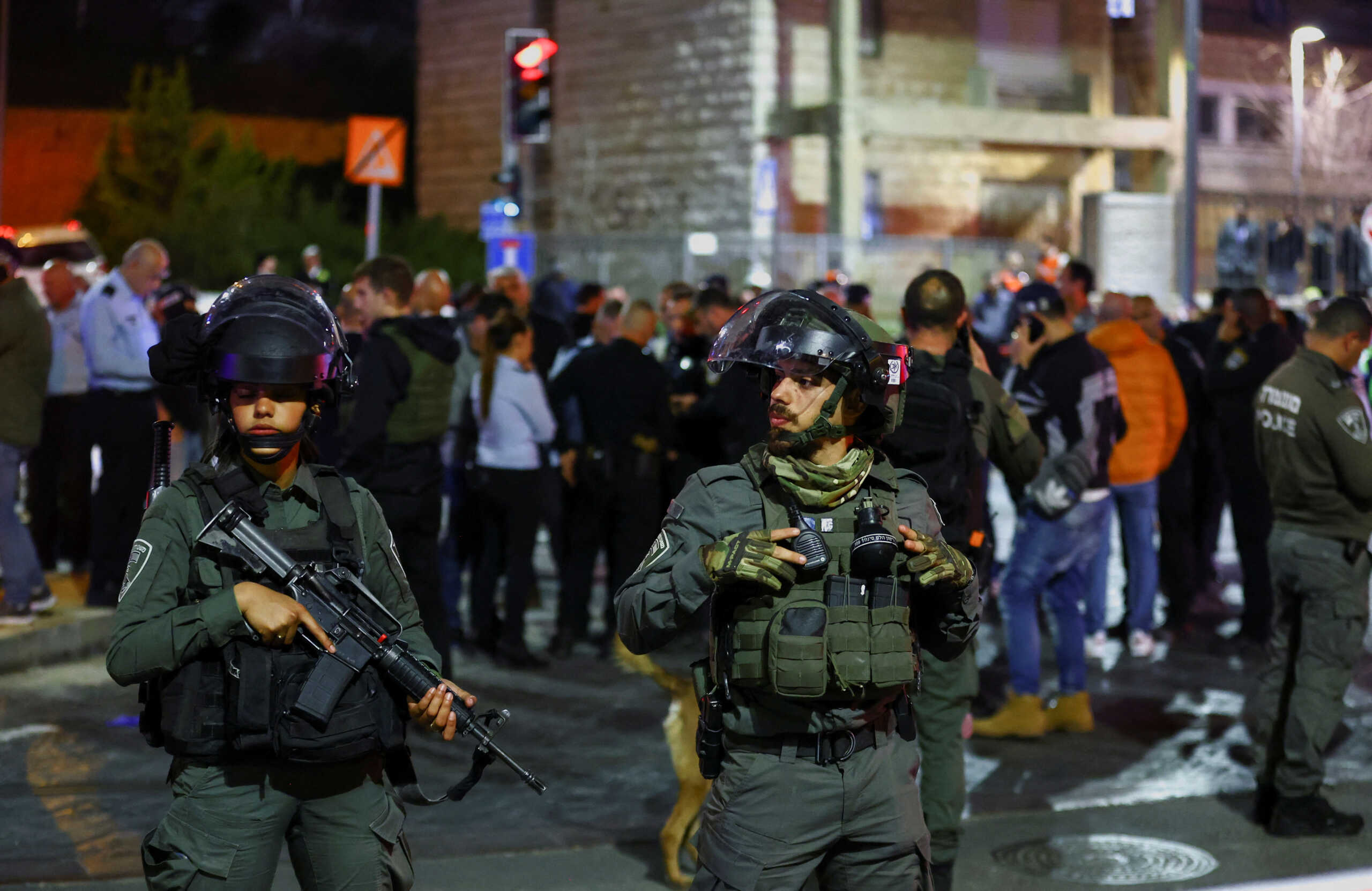 Israeli forces stand guard near the scene of a shooting attack in Neve Yaacov which lies on occupied land that Israel annexed to Jerusalem after the 1967 Middle East war January 27, 2023. REUTERS