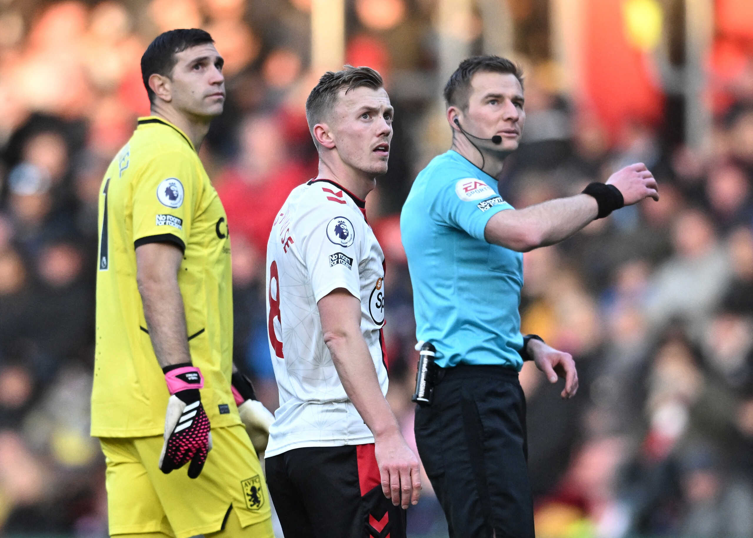 Soccer Football - Premier League - Southampton v Aston Villa - St Mary's Stadium, Southampton, Britain - January 21, 2023 Southampton's James Ward-Prowse, Aston Villa's Emiliano Martinez and referee Michael Salisbury react as a drone stops play REUTERS