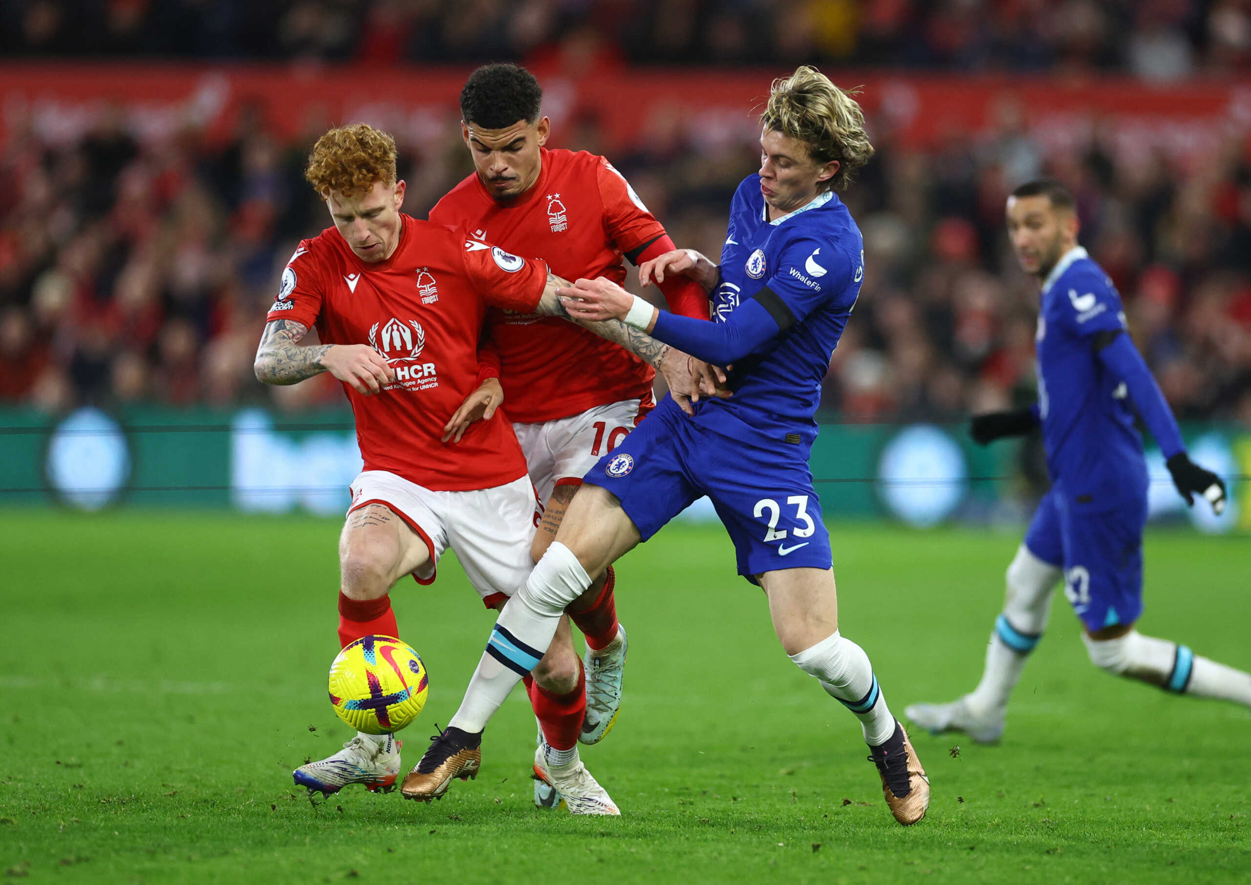 Soccer Football - Premier League - Nottingham Forest v Chelsea - The City Ground, Nottingham, Britain - January 1, 2023 Nottingham Forest's Jack Colback and Morgan Gibbs-White in action with Chelsea's Conor Gallagher REUTERS