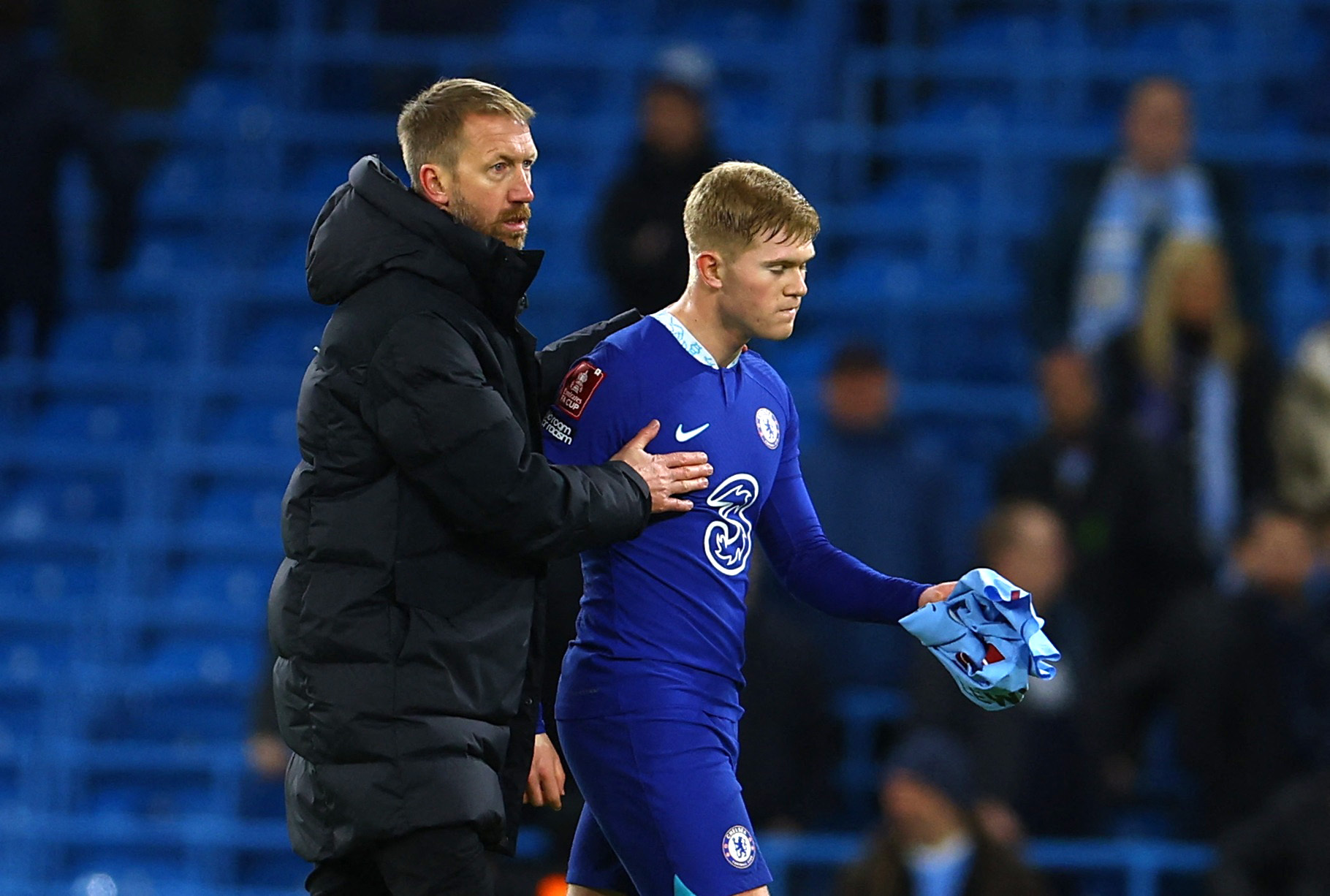 Soccer Football - FA Cup Third Round - Manchester City v Chelsea - Etihad Stadium, Manchester, Britain - January 8, 2023 Chelsea's Lewis Hall looks dejected alongside manager Graham Potter after the match REUTERS