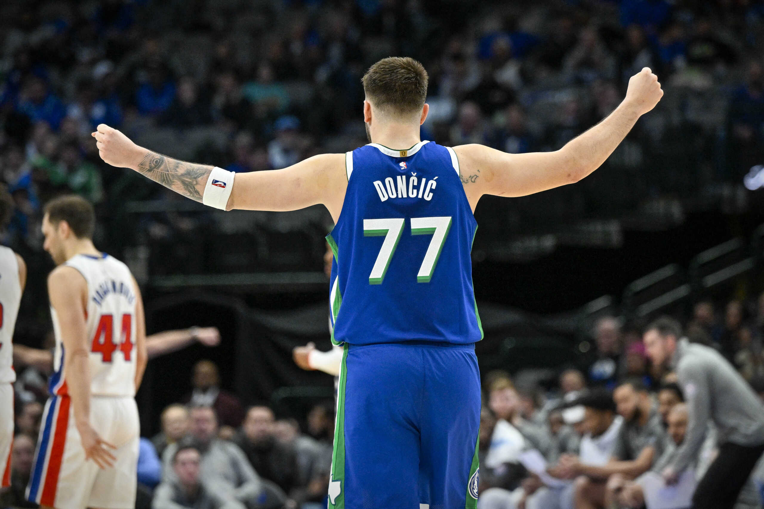 Jan 30, 2023; Dallas, Texas, USA; Dallas Mavericks guard Luka Doncic (77) motions to his teammates during the second half of the game against the Detroit Pistons at the American Airlines Center. Mandatory Credit: Jerome Miron-USA TODAY Sports