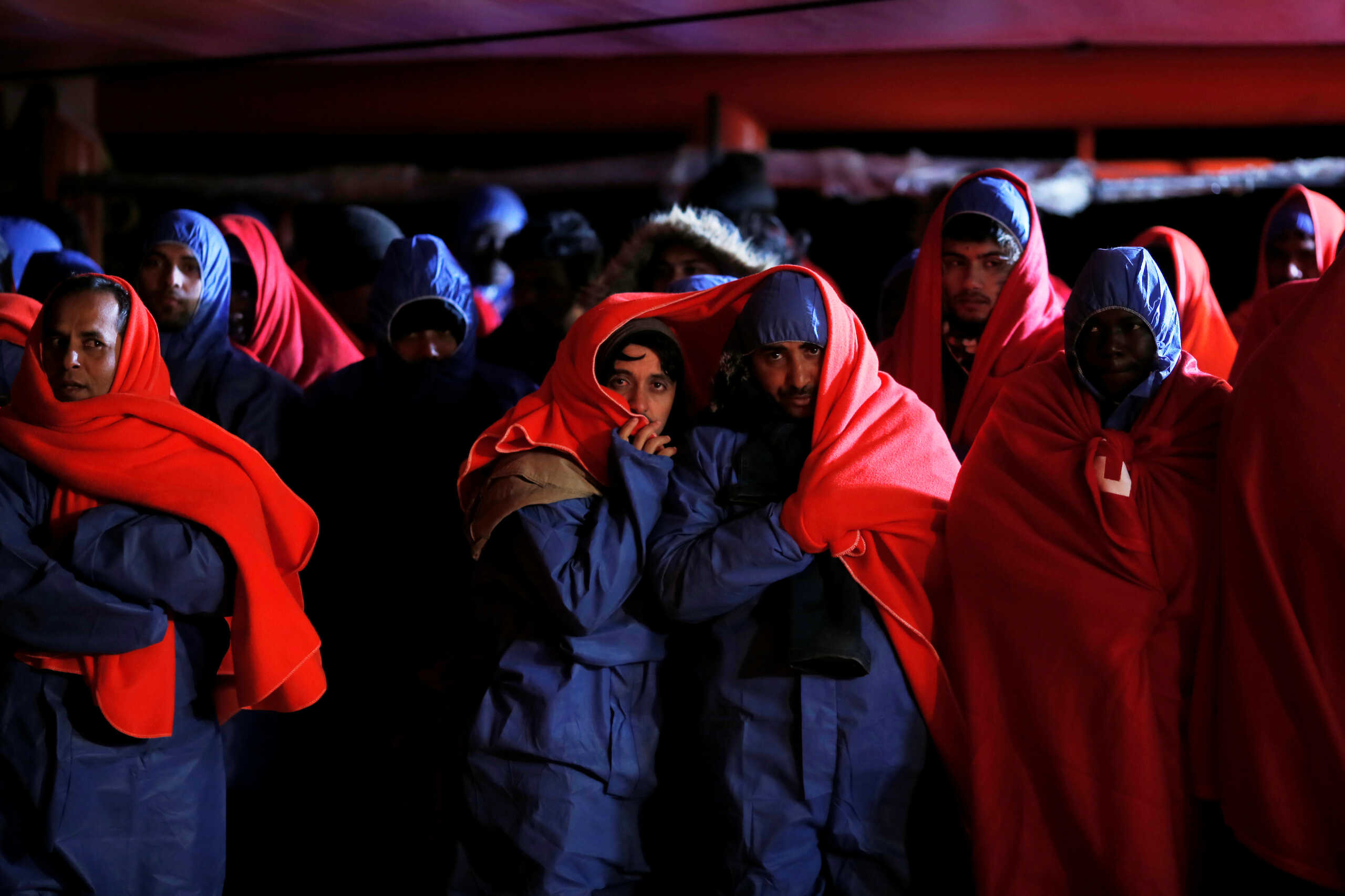 Migrants, intercepted off the coast in the Mediterranean Sea, wait to disembark from a rescue boat at the port of Malaga, southern Spain, January 3, 2019. REUTERS